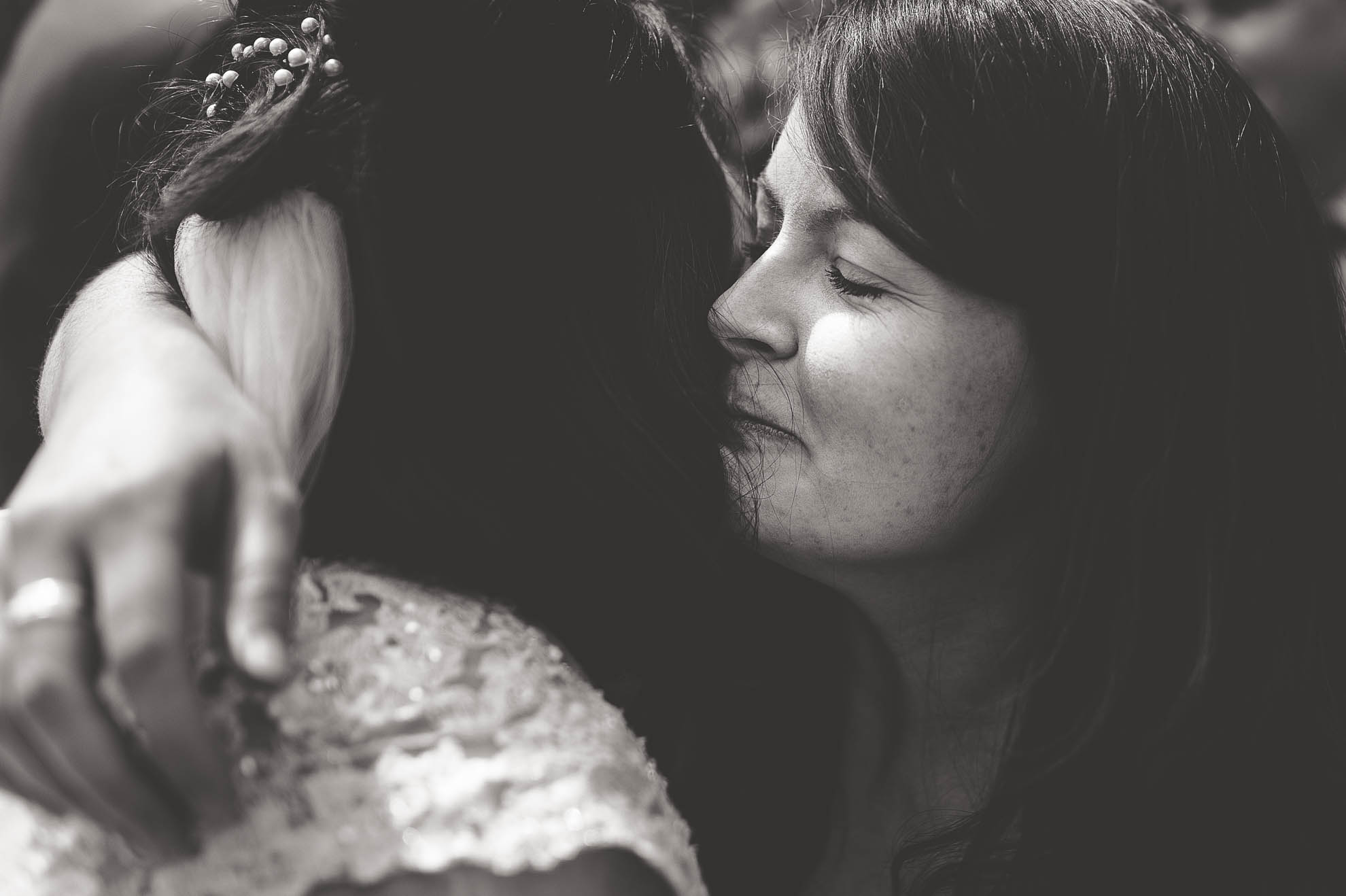 Guest hugs bride