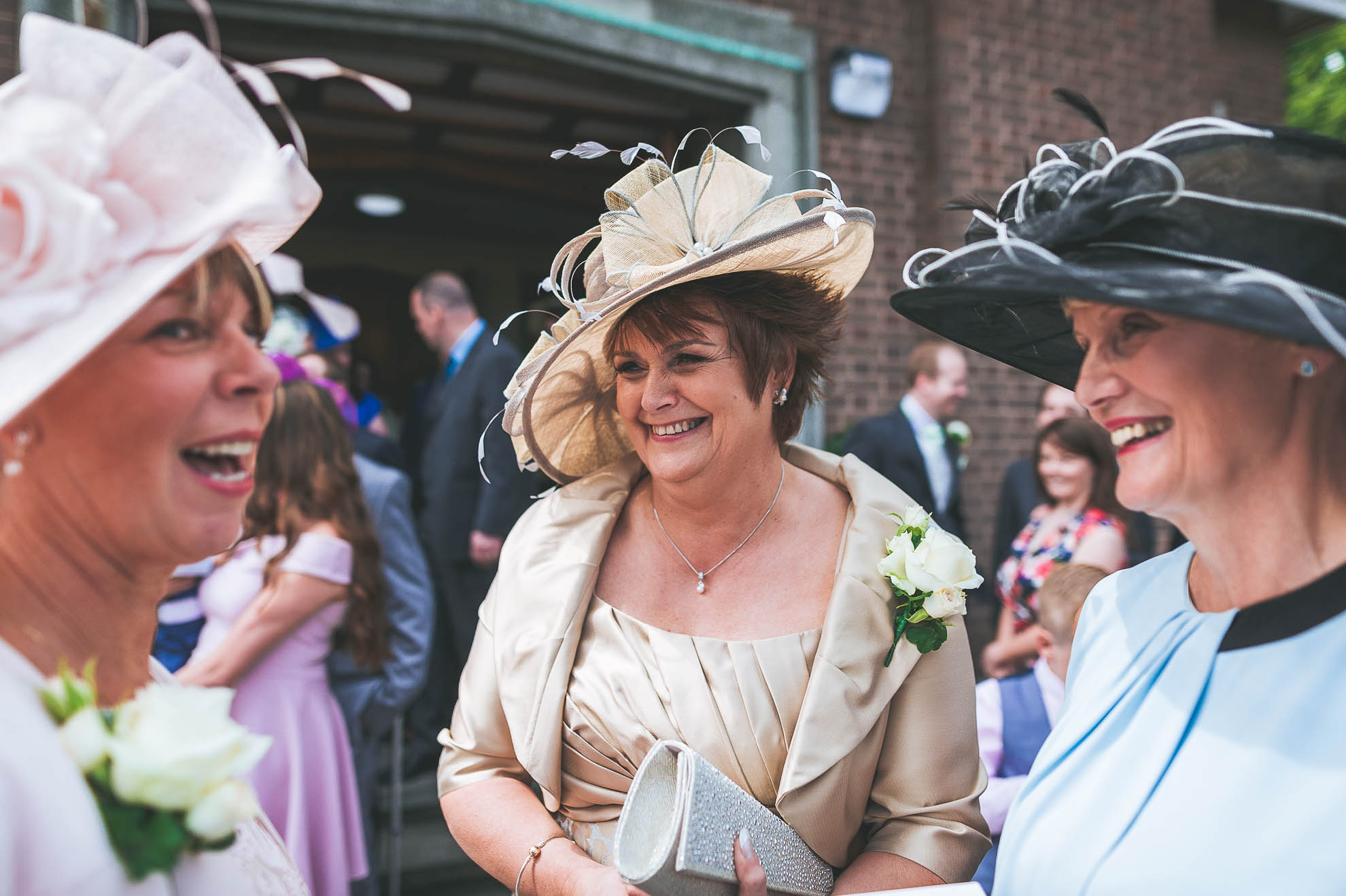 Mother of the bride and groom share a joke