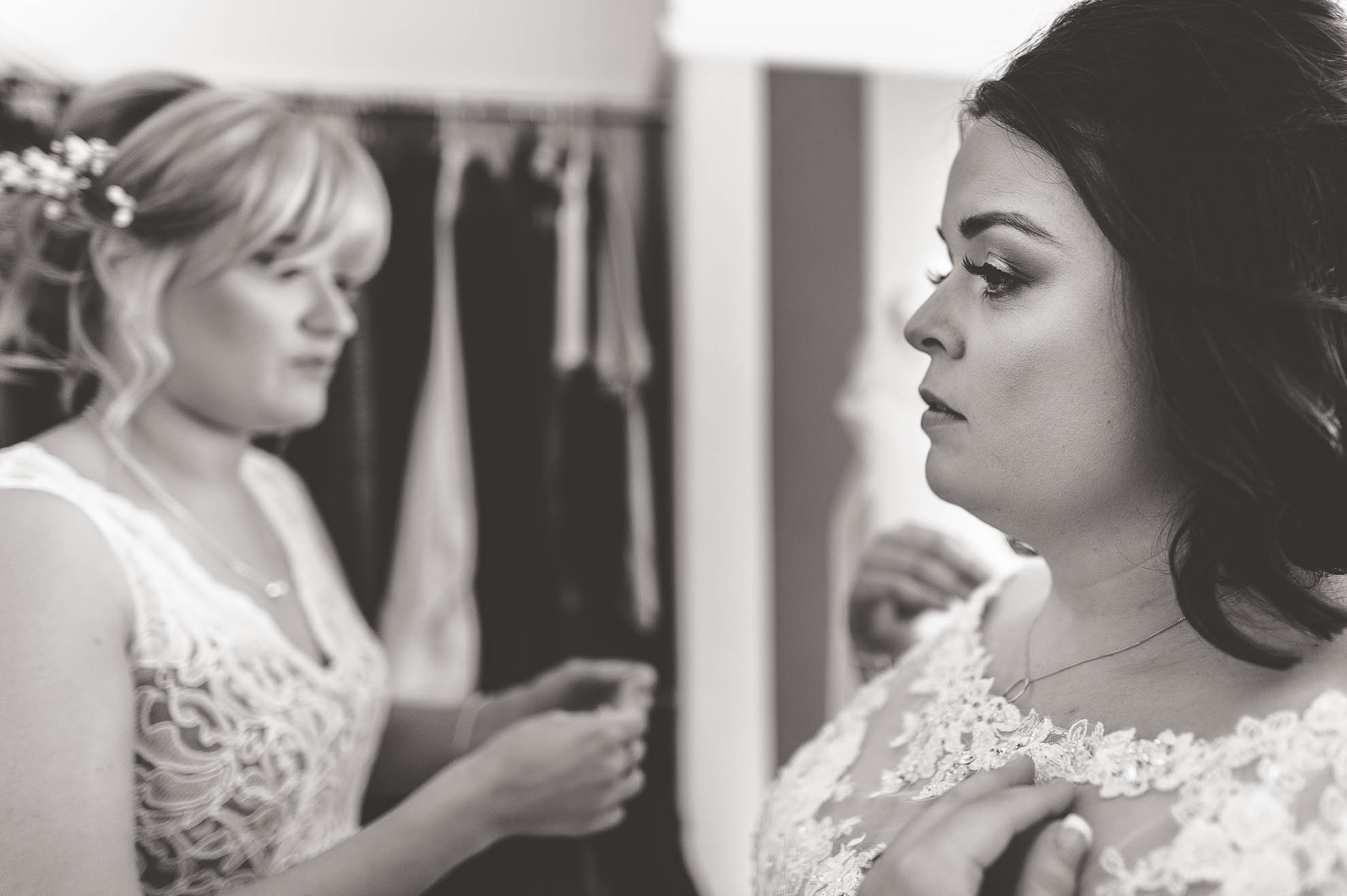Bride looking in mirror