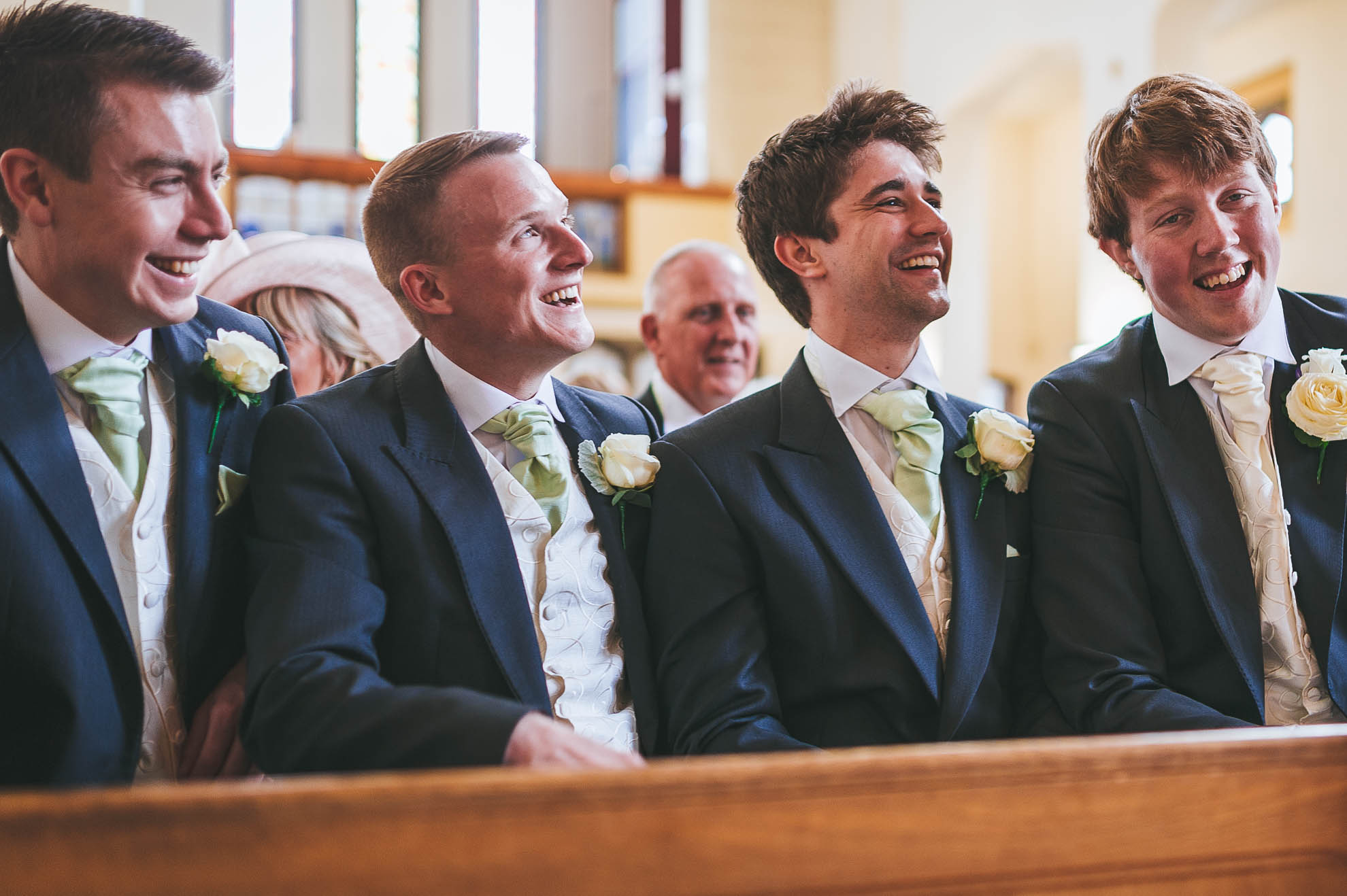 Groom shares a joke with ushers