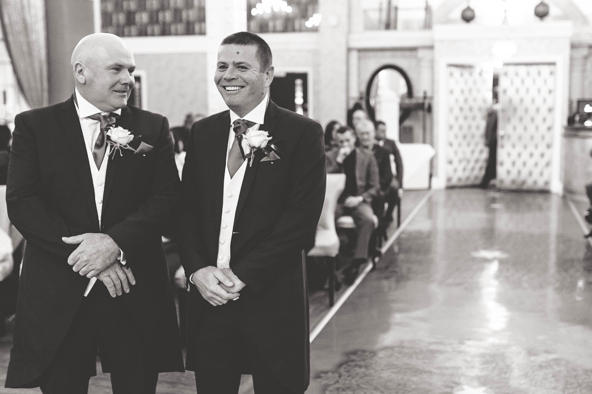 Groom waiting in the ceremony room with best man