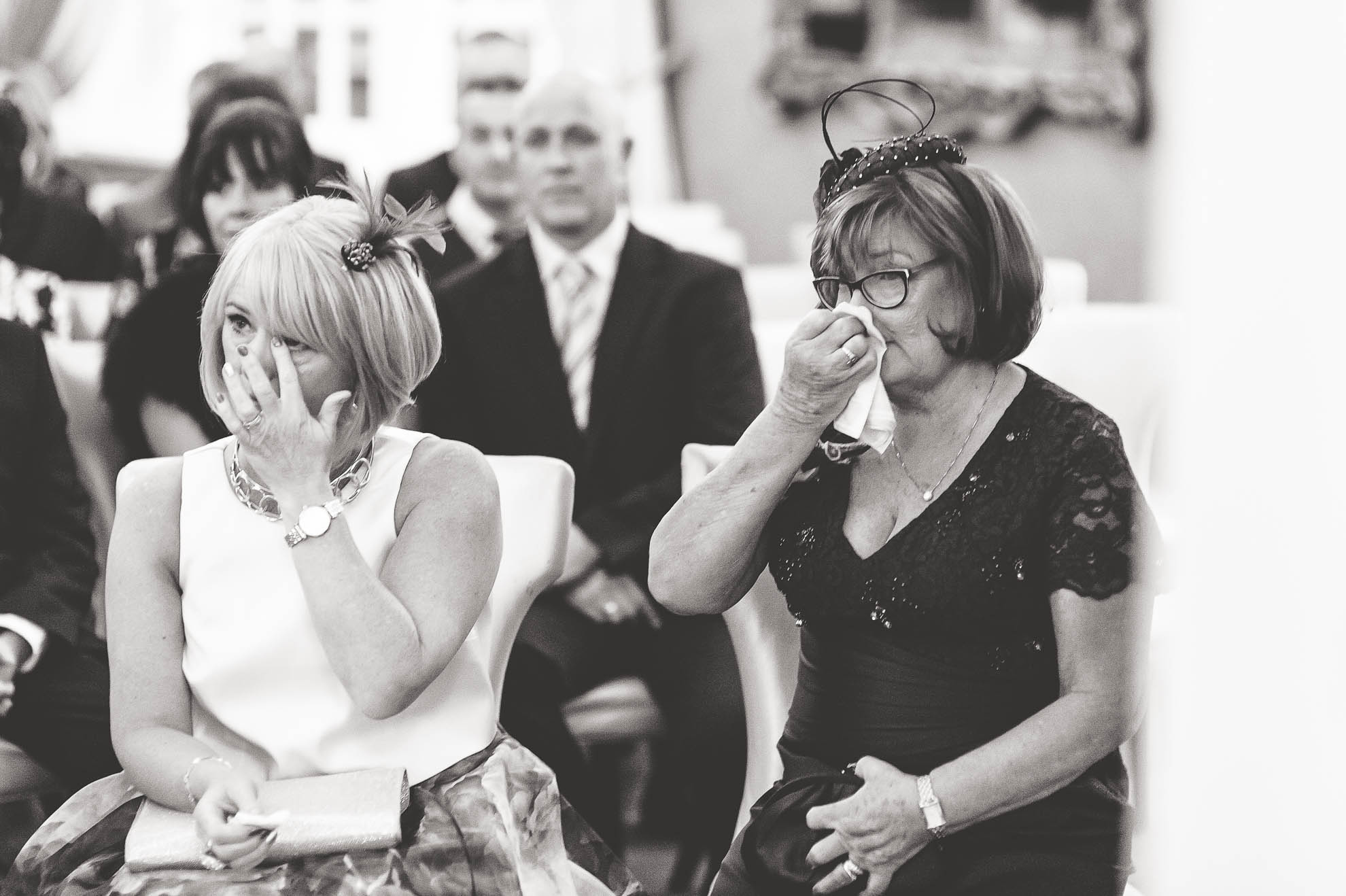 Guests shedding tears during the exchange of vows
