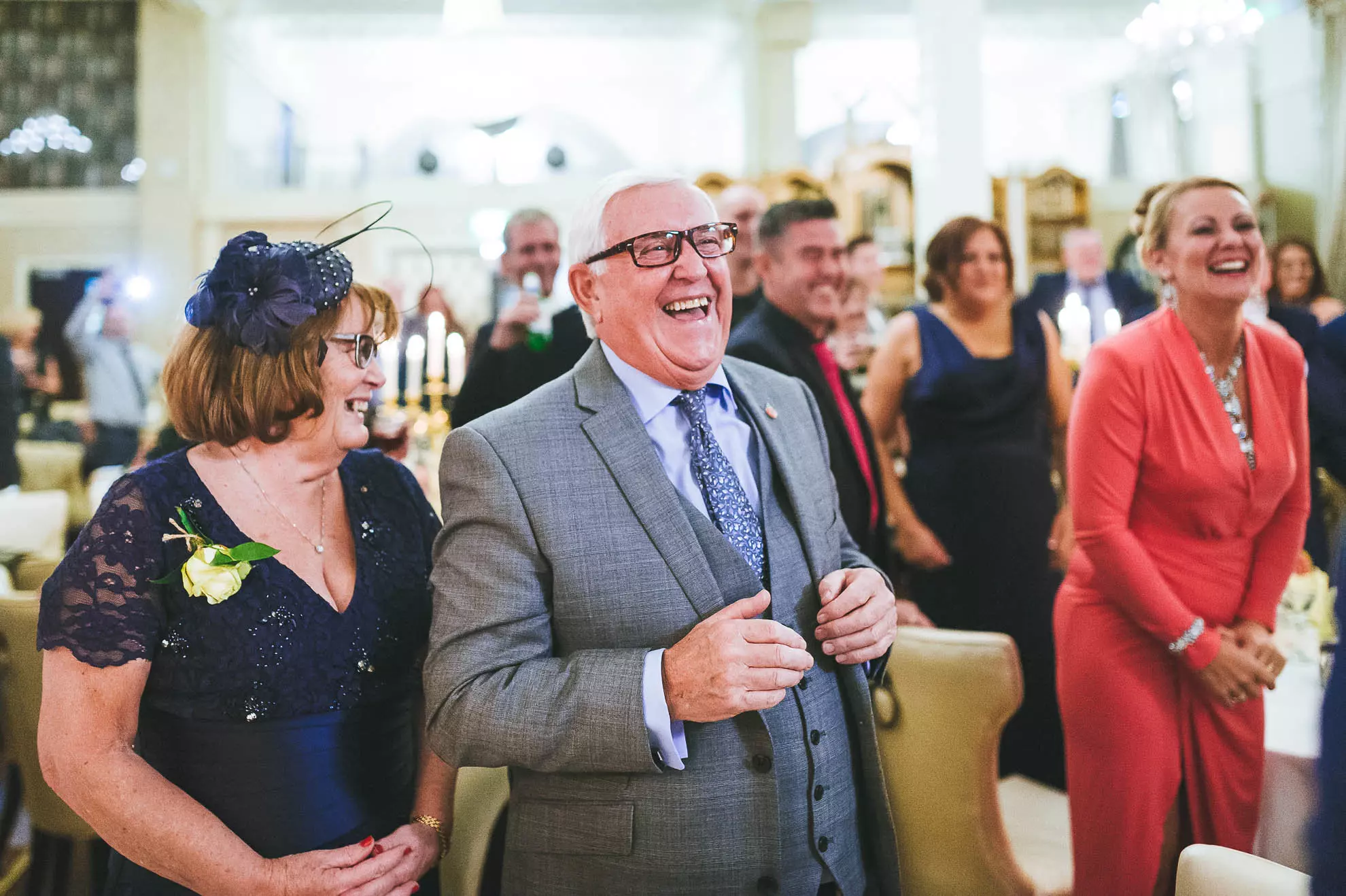 Guests laugh at best man's joke during the speeches