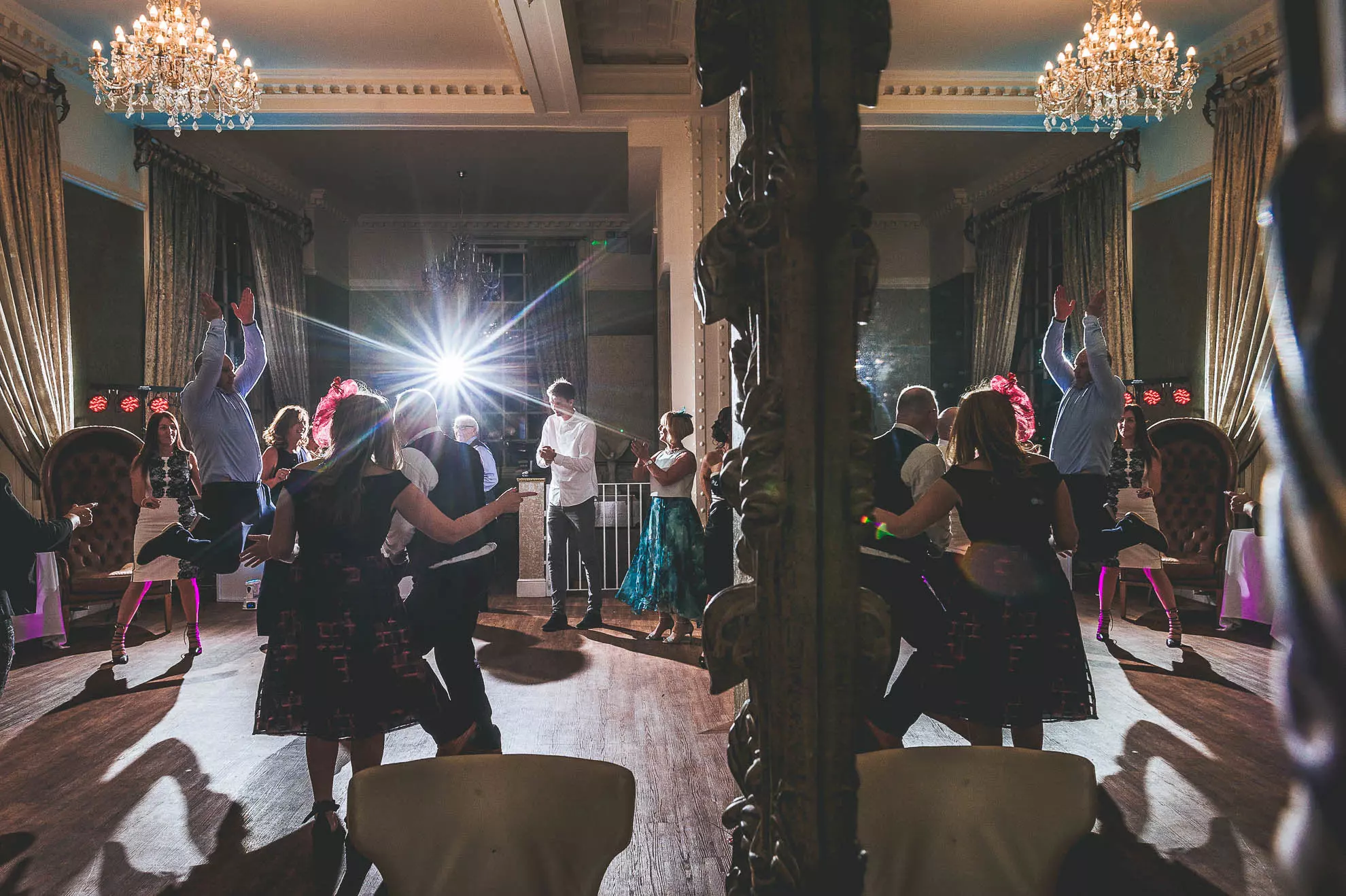 Guests dancing with mirror reflection