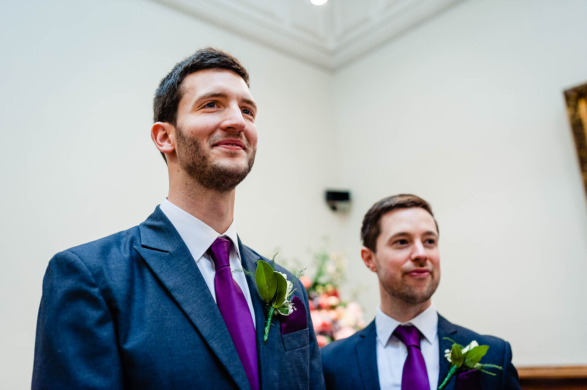 Groom watches as his bride walks down the aisle