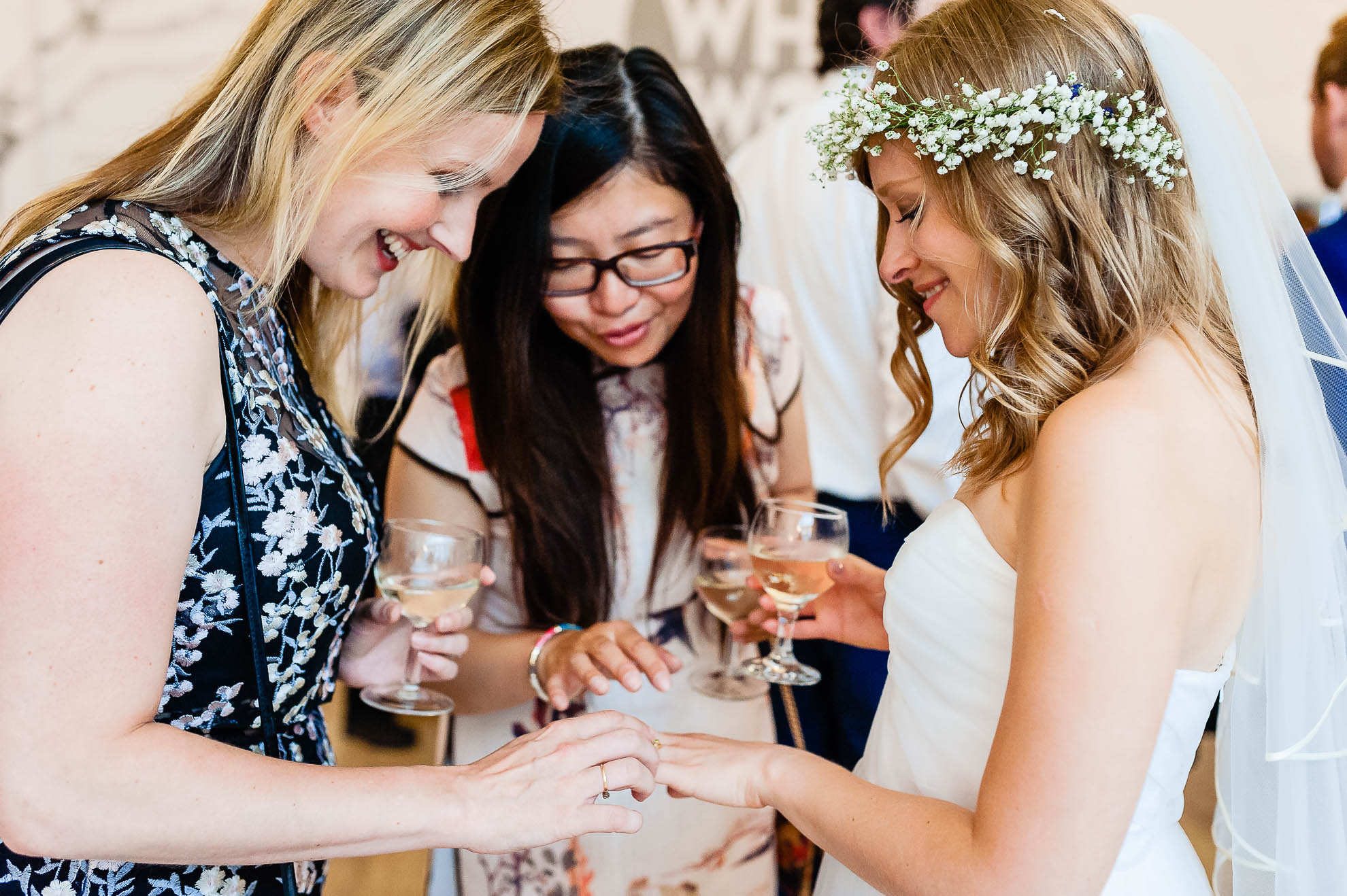 Guests admire brides wedding ring