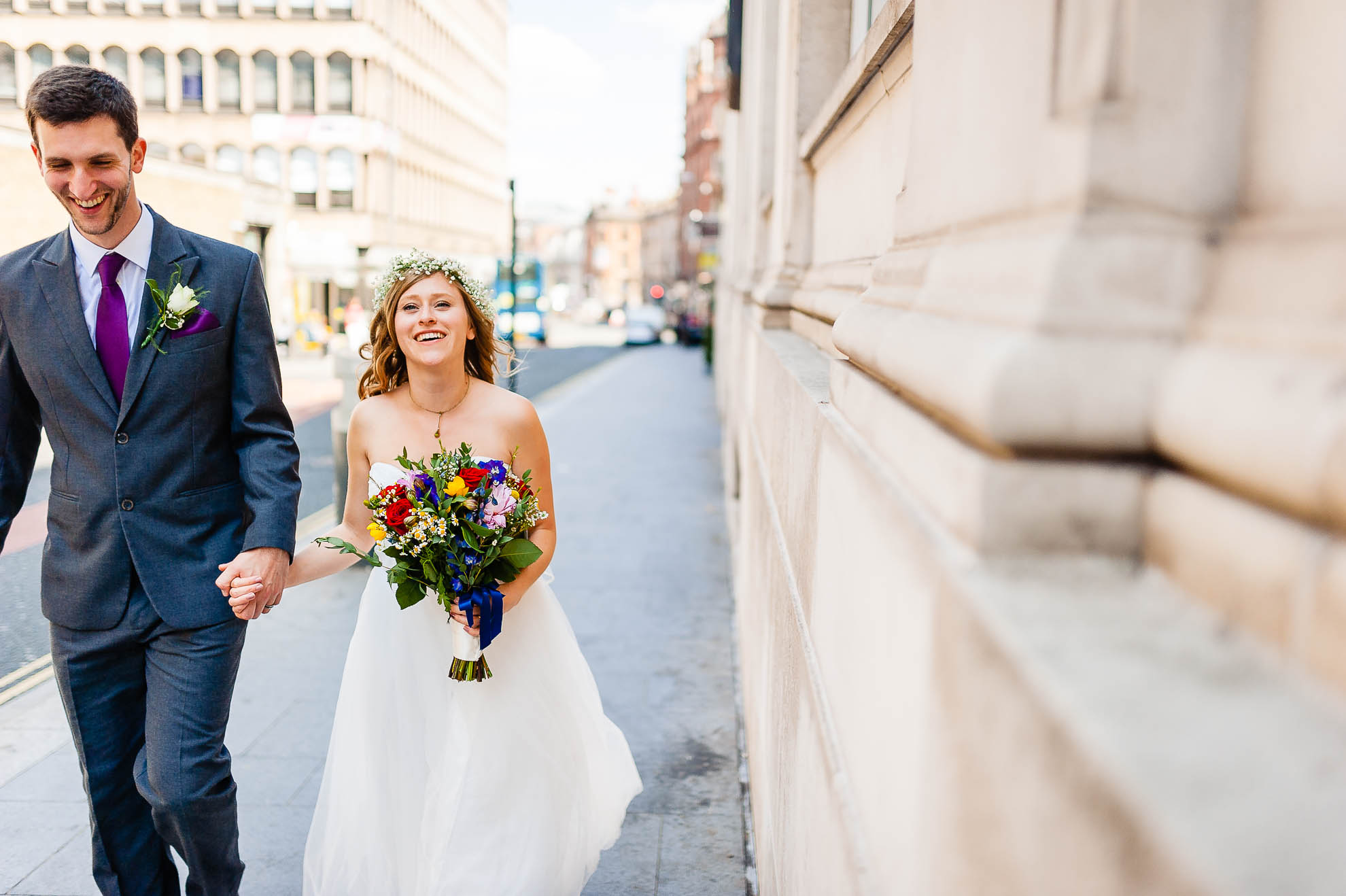 Bride and groom walk to Oh Me Oh my wedding venue