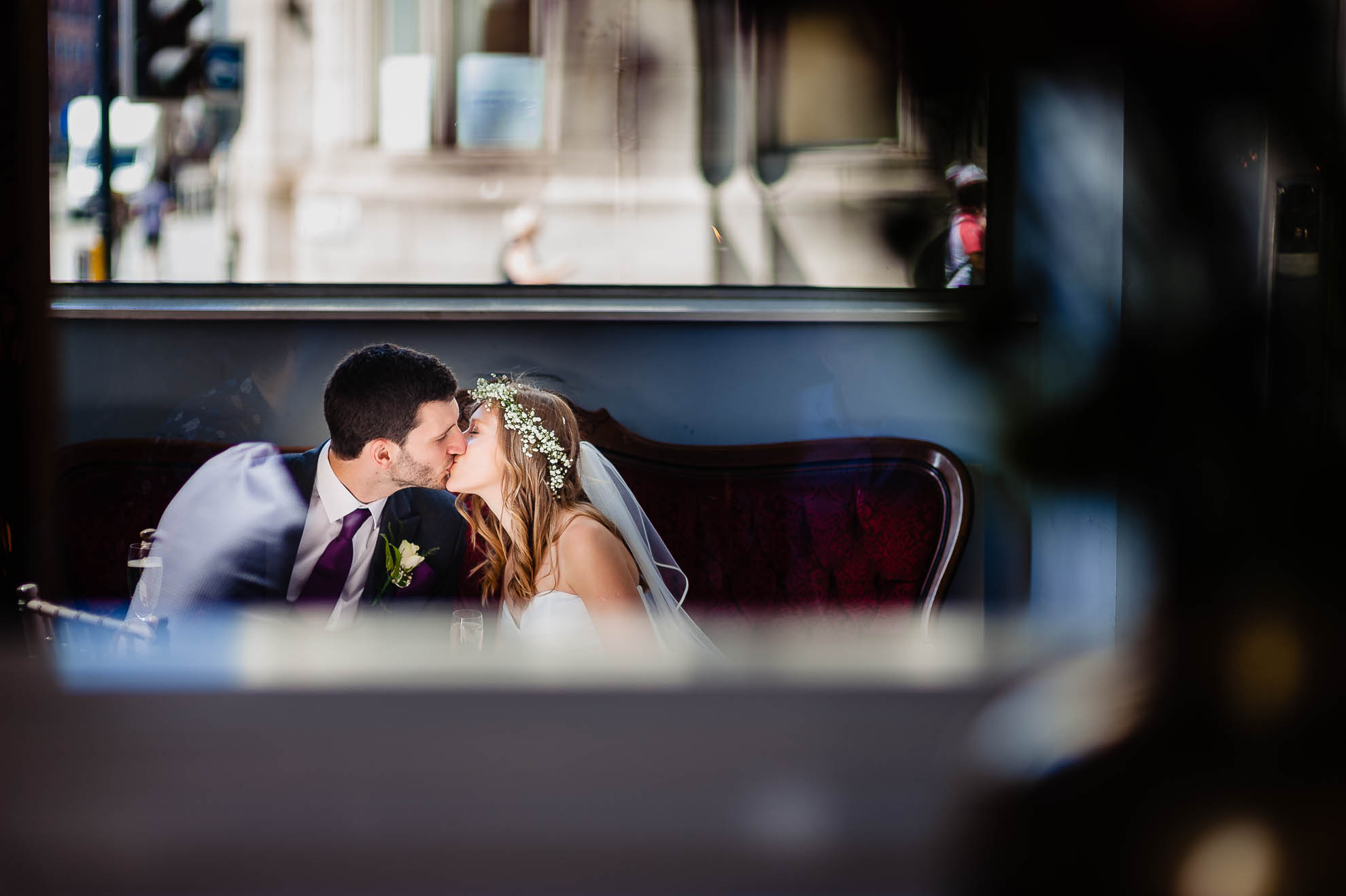 Bride and groom kiss in reception of Oh Me Oh My