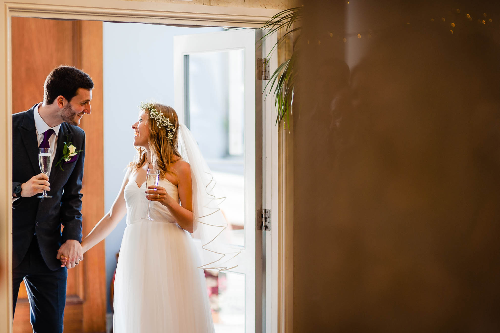 Bride and groom talking before they enter the wedding breakfast