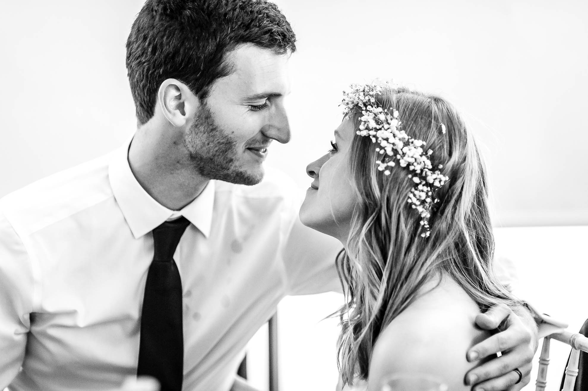 Bride and groom look into each others eyes