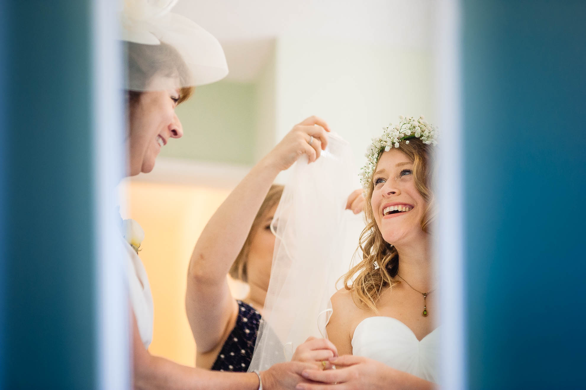 Bride and her mother share a joke during the bridal preparations