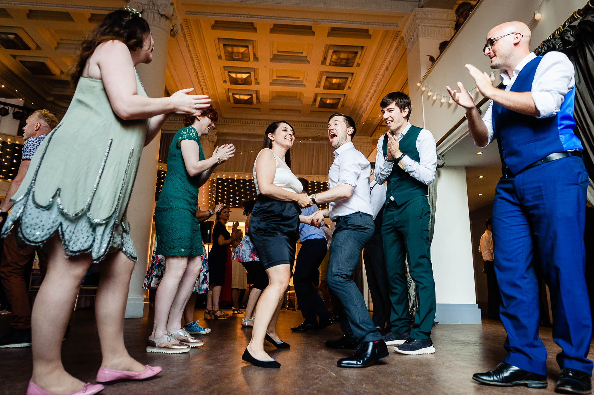 Best man and partner Ceilidh dancing
