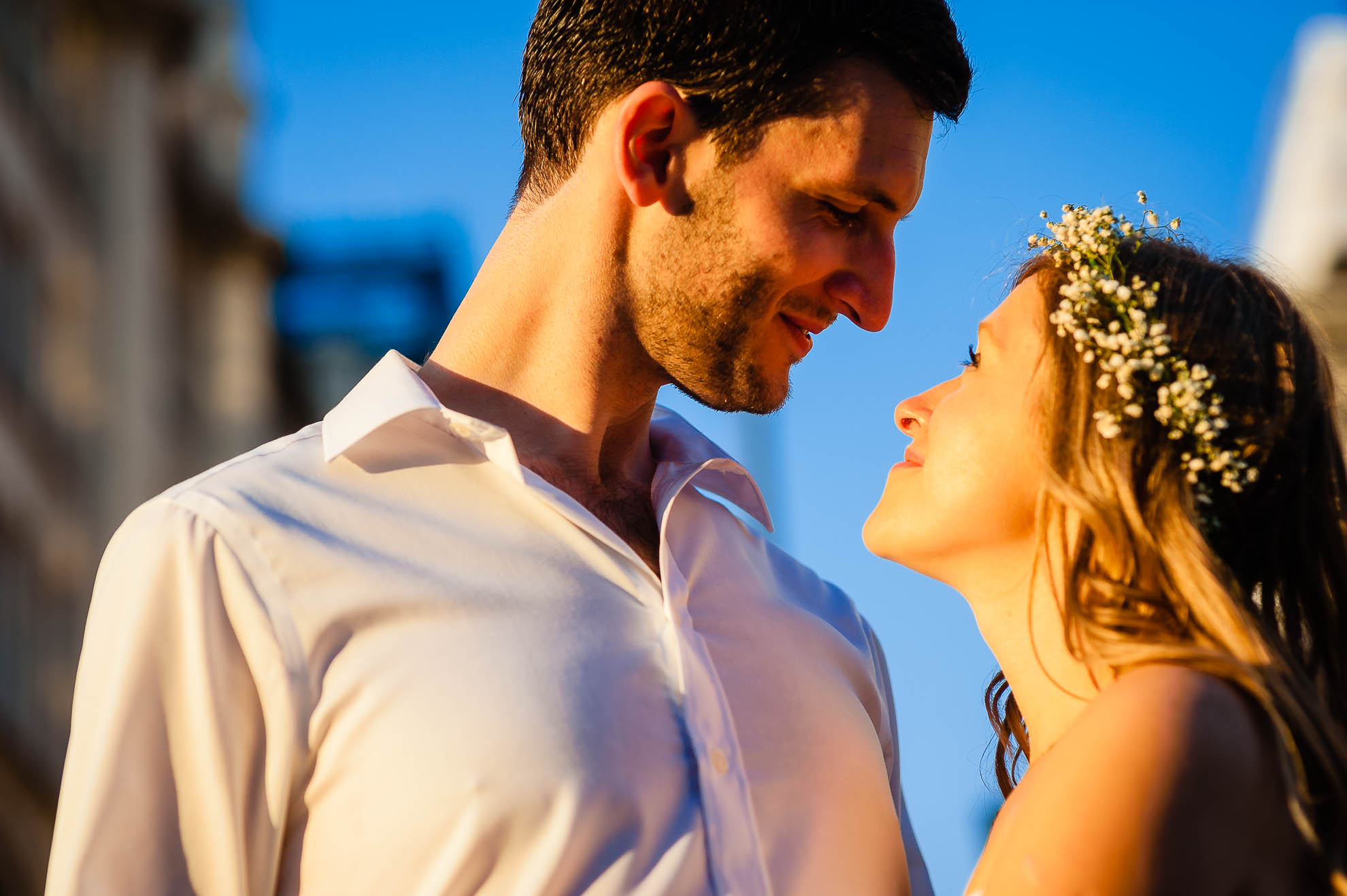 Bride and groom hug in the sunset