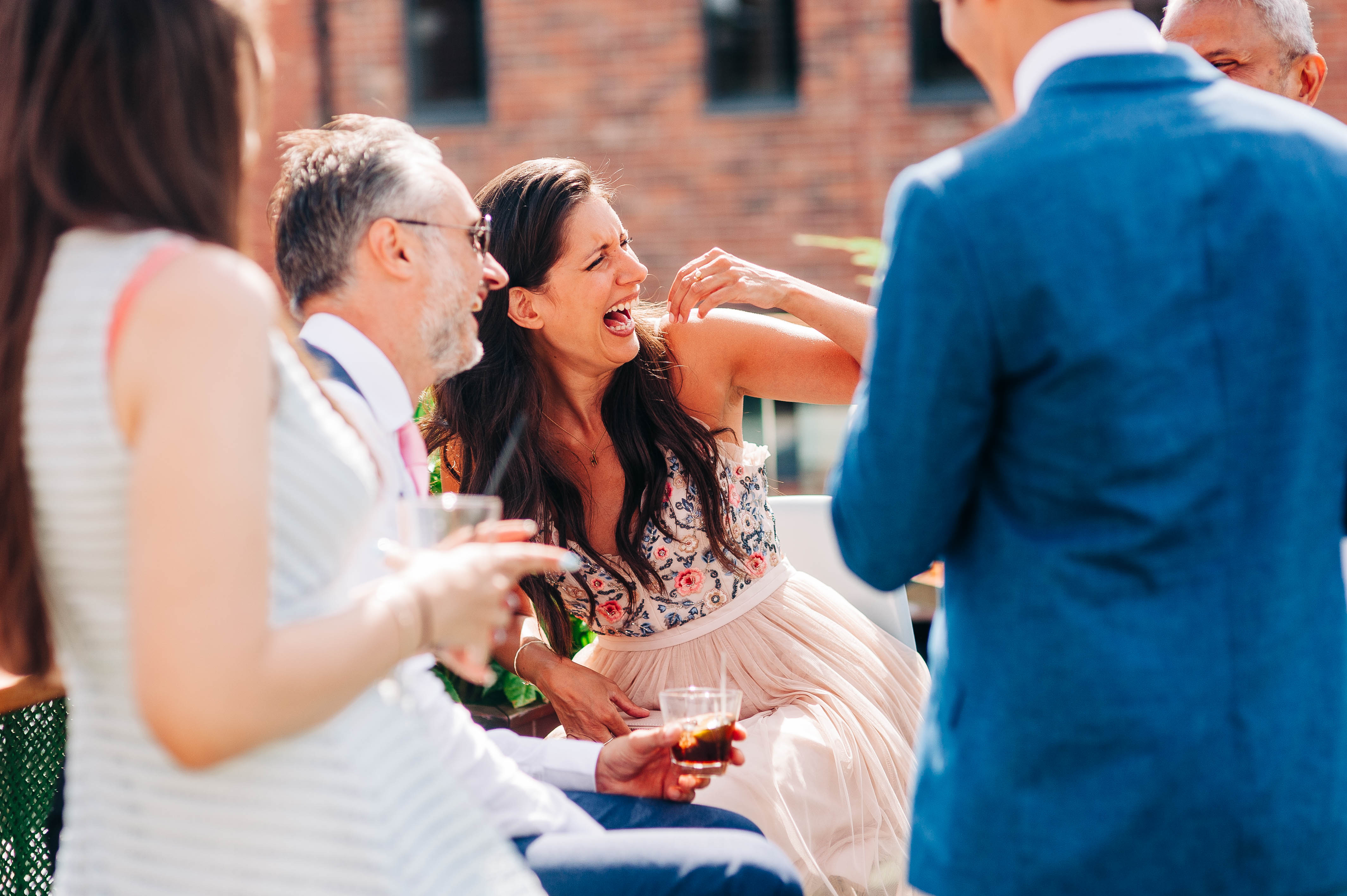 Wedding guests sharing a joke