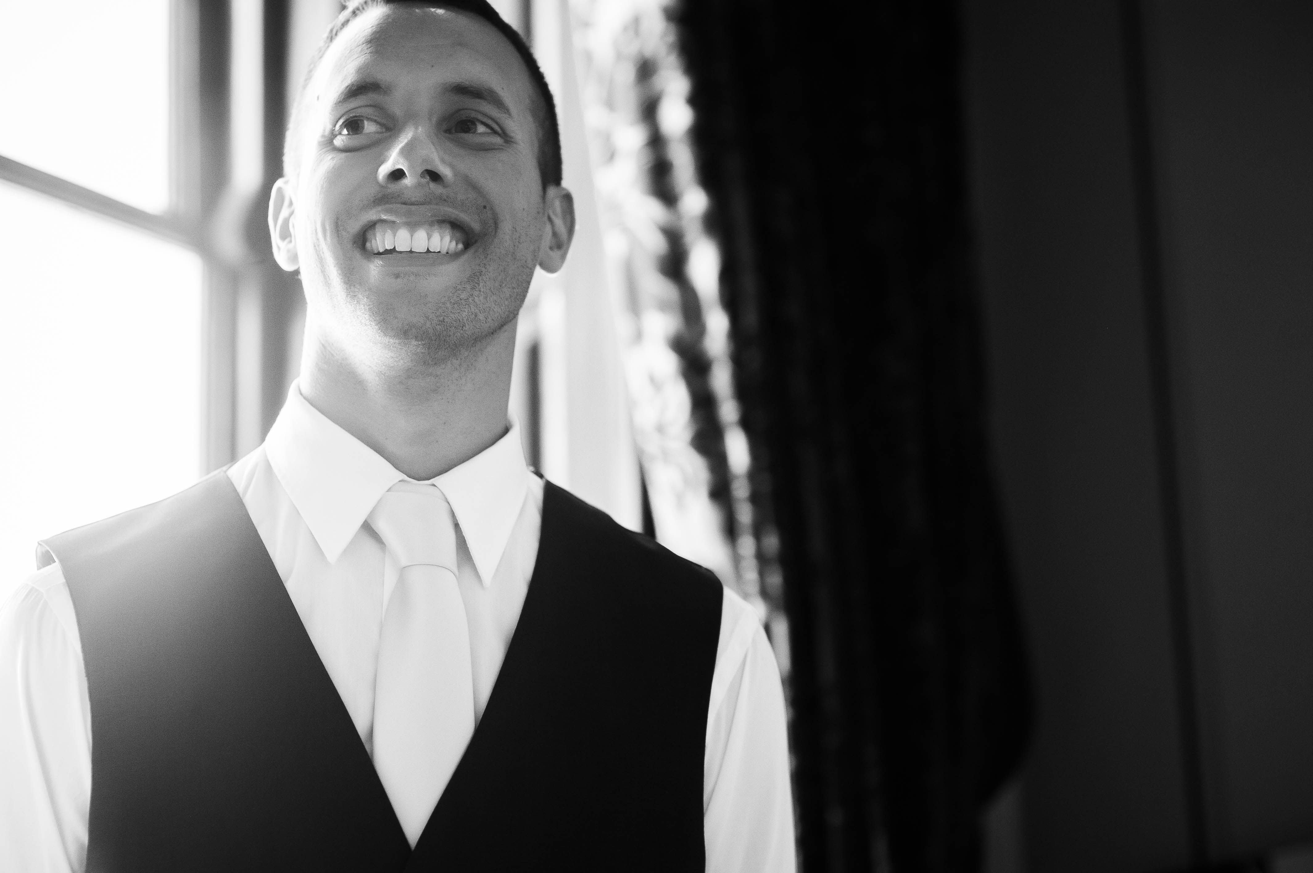 Groom smiles during speeches