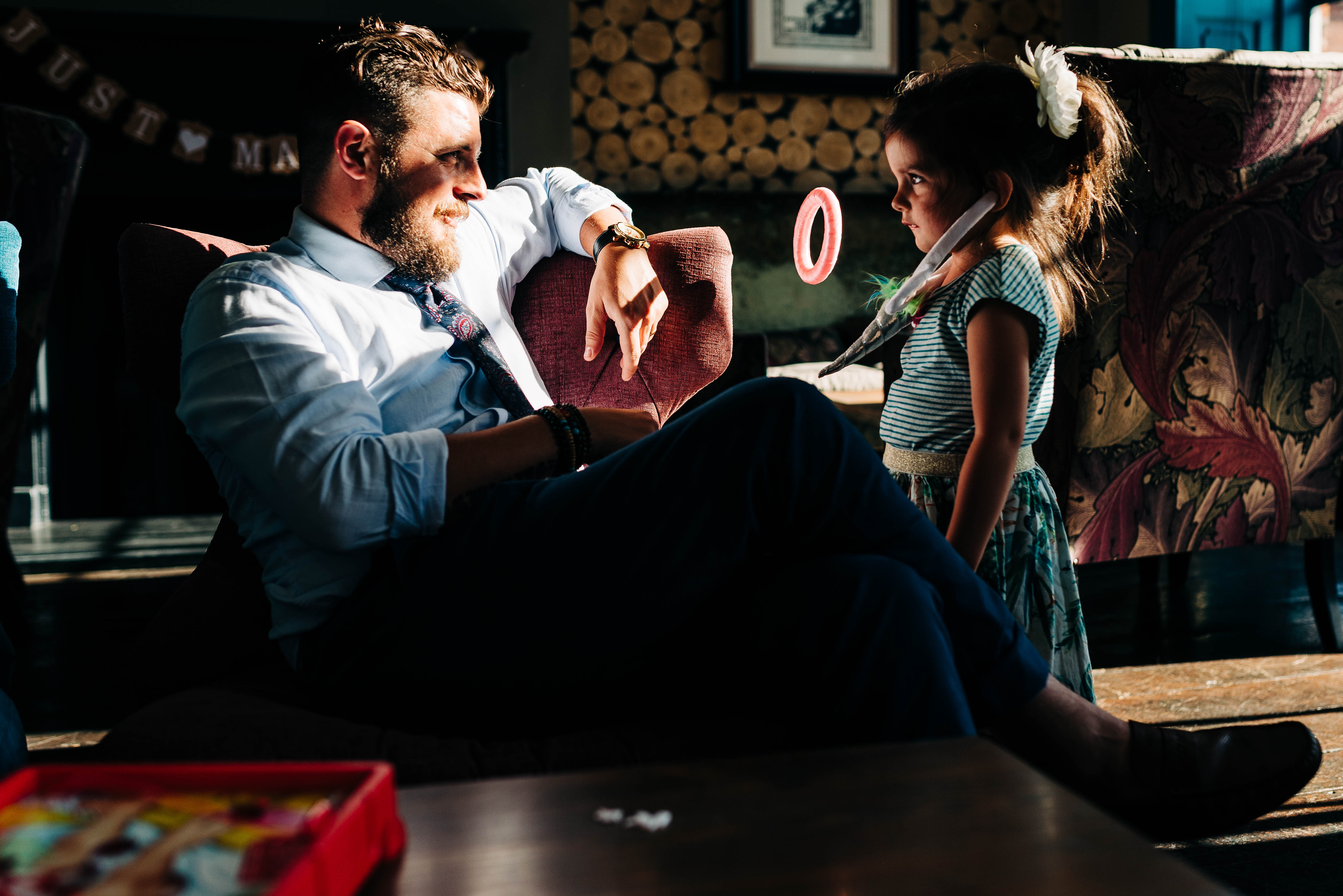 Little girl and her father play together