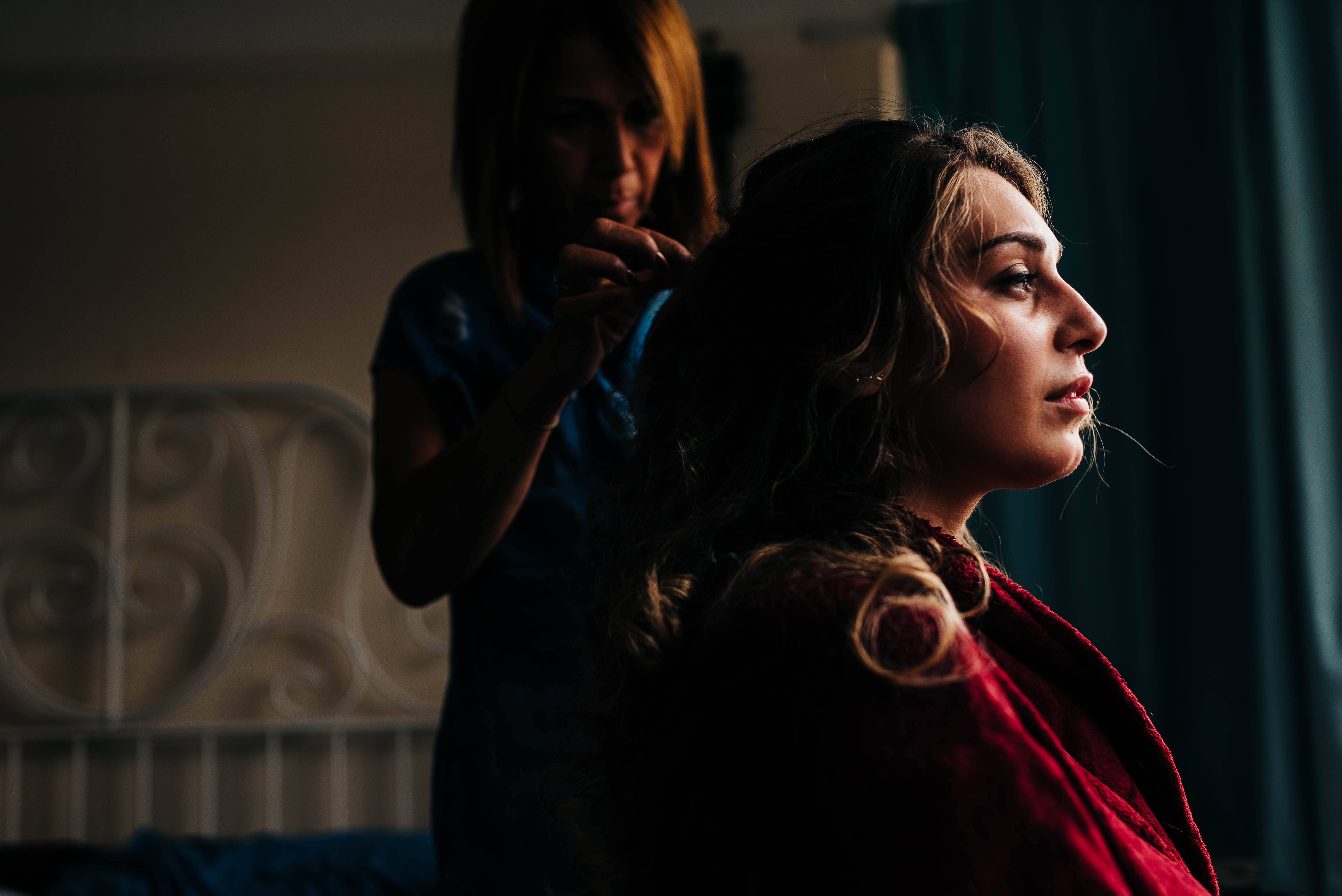 Profile of the bride as she has her hair done