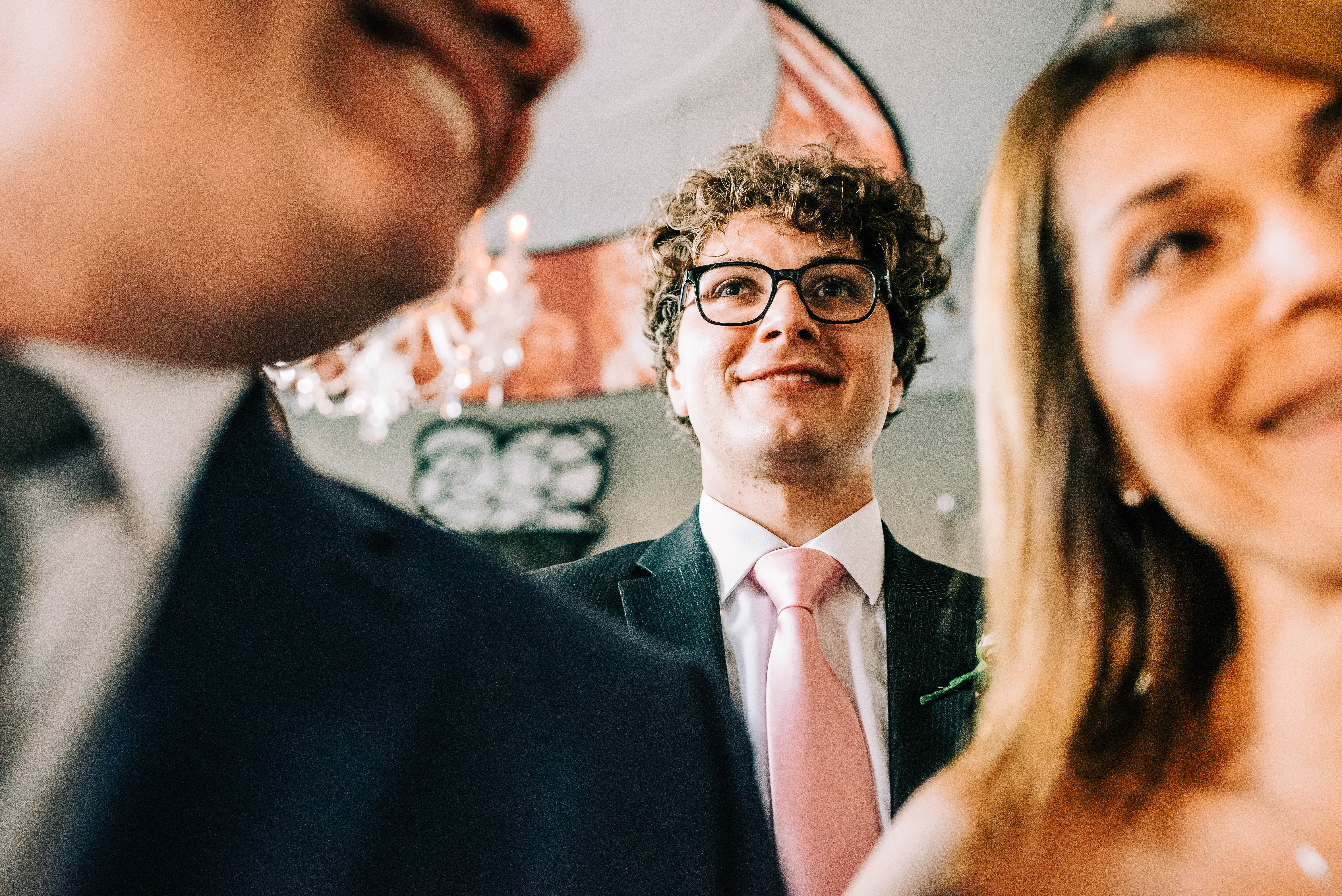 Brides brother watches the happy couple's first dance