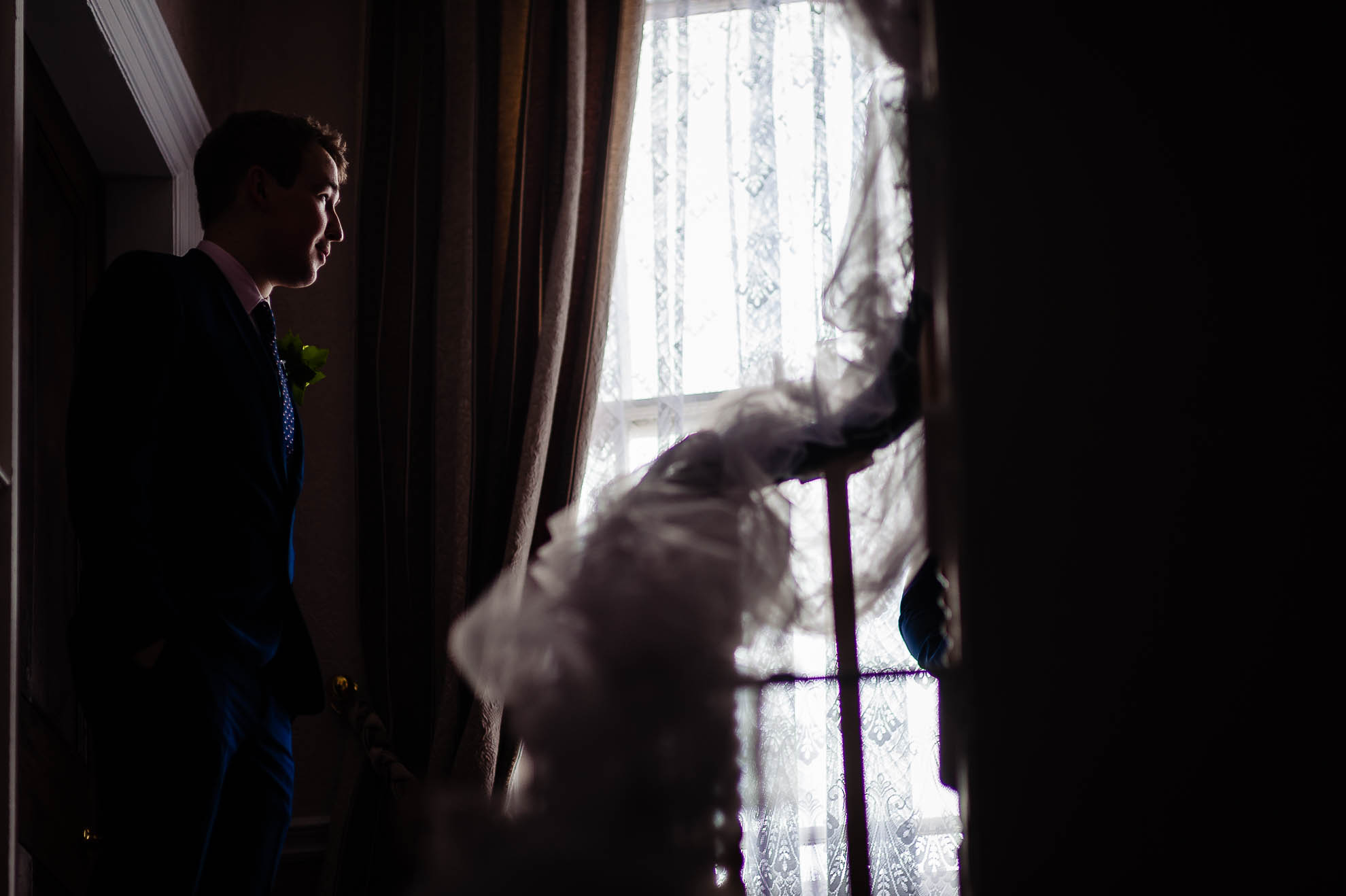Brides brother looking out of the window