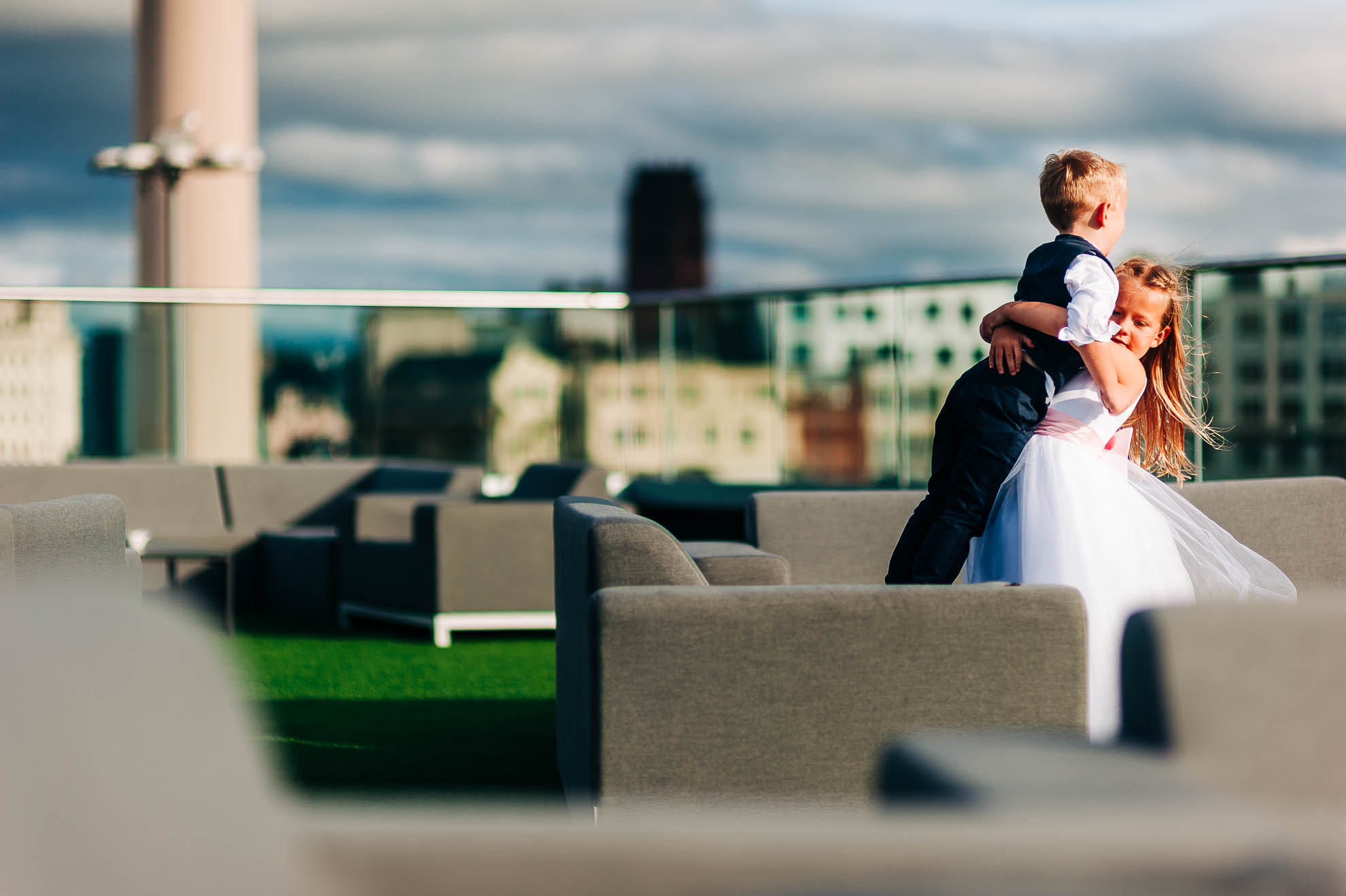 Flower girl and little boy play