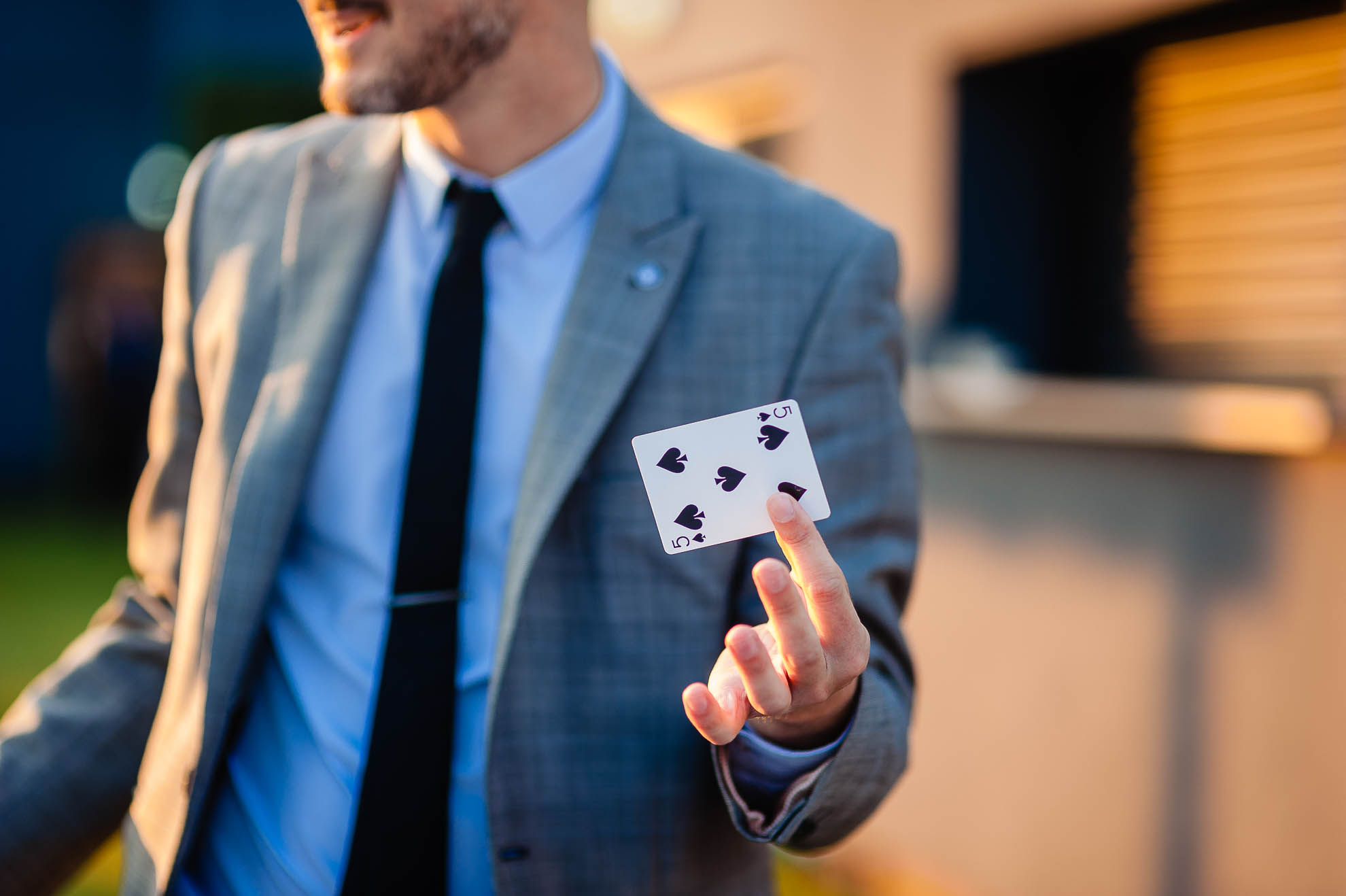 Magician shows a playing card