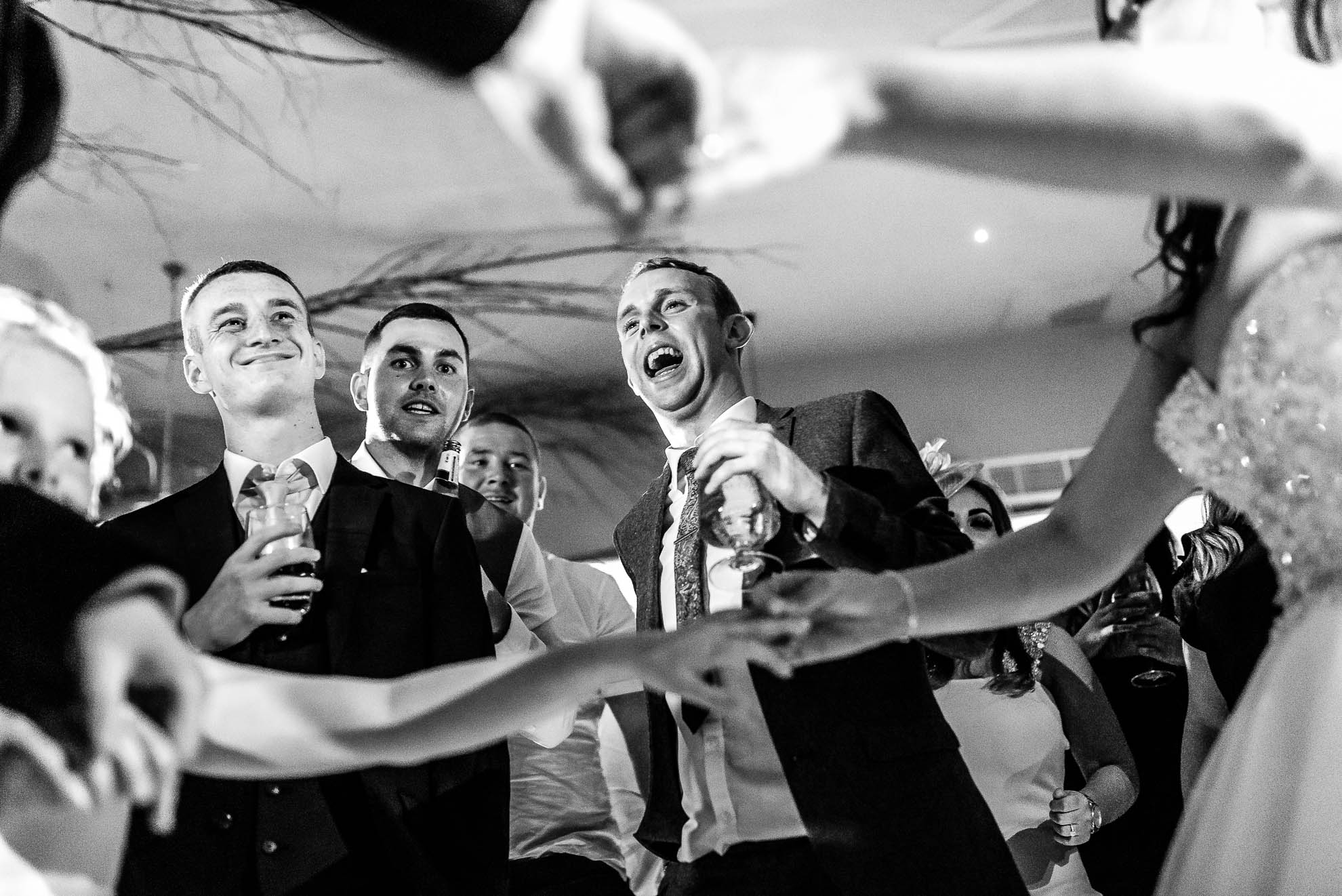 Guests cheer the bride and groom during the first dance