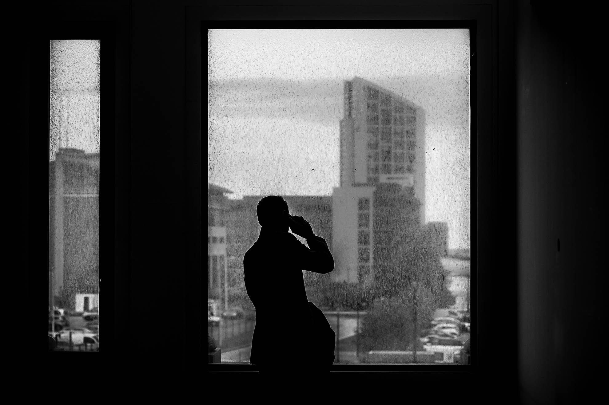 Silhouette of wedding guest in window