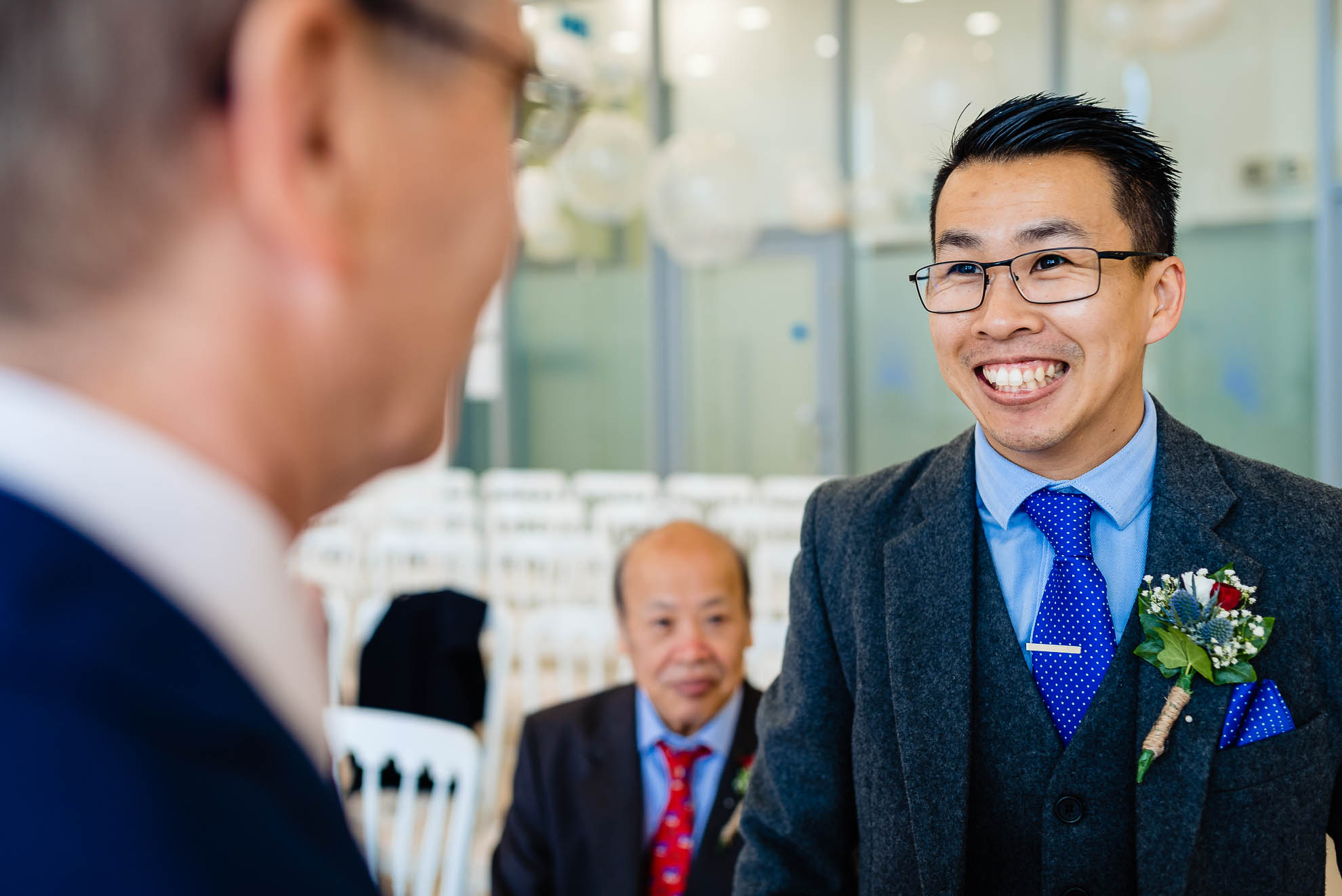Groom chats with wedding celebrant