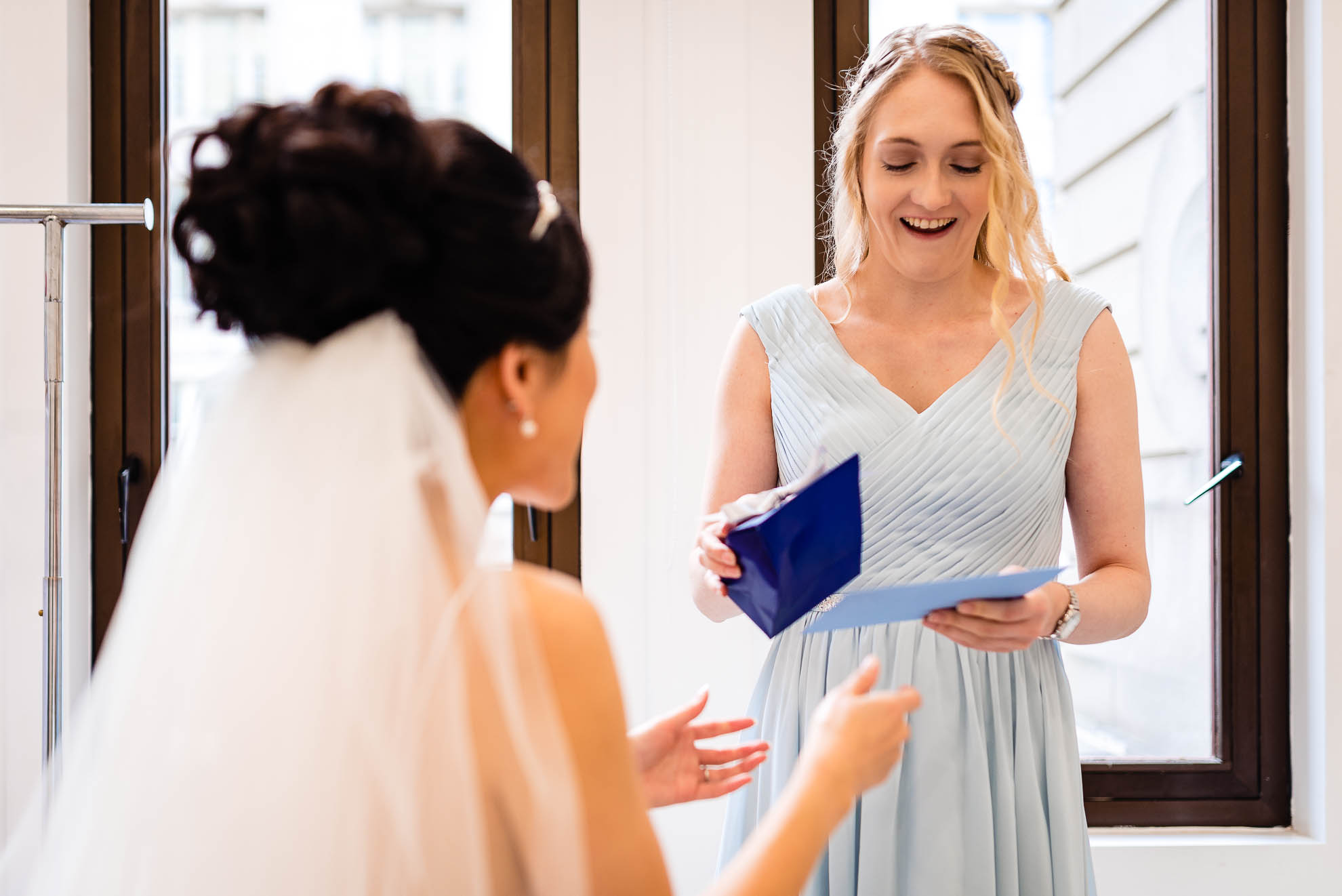 Bridesmaid smiles at her present