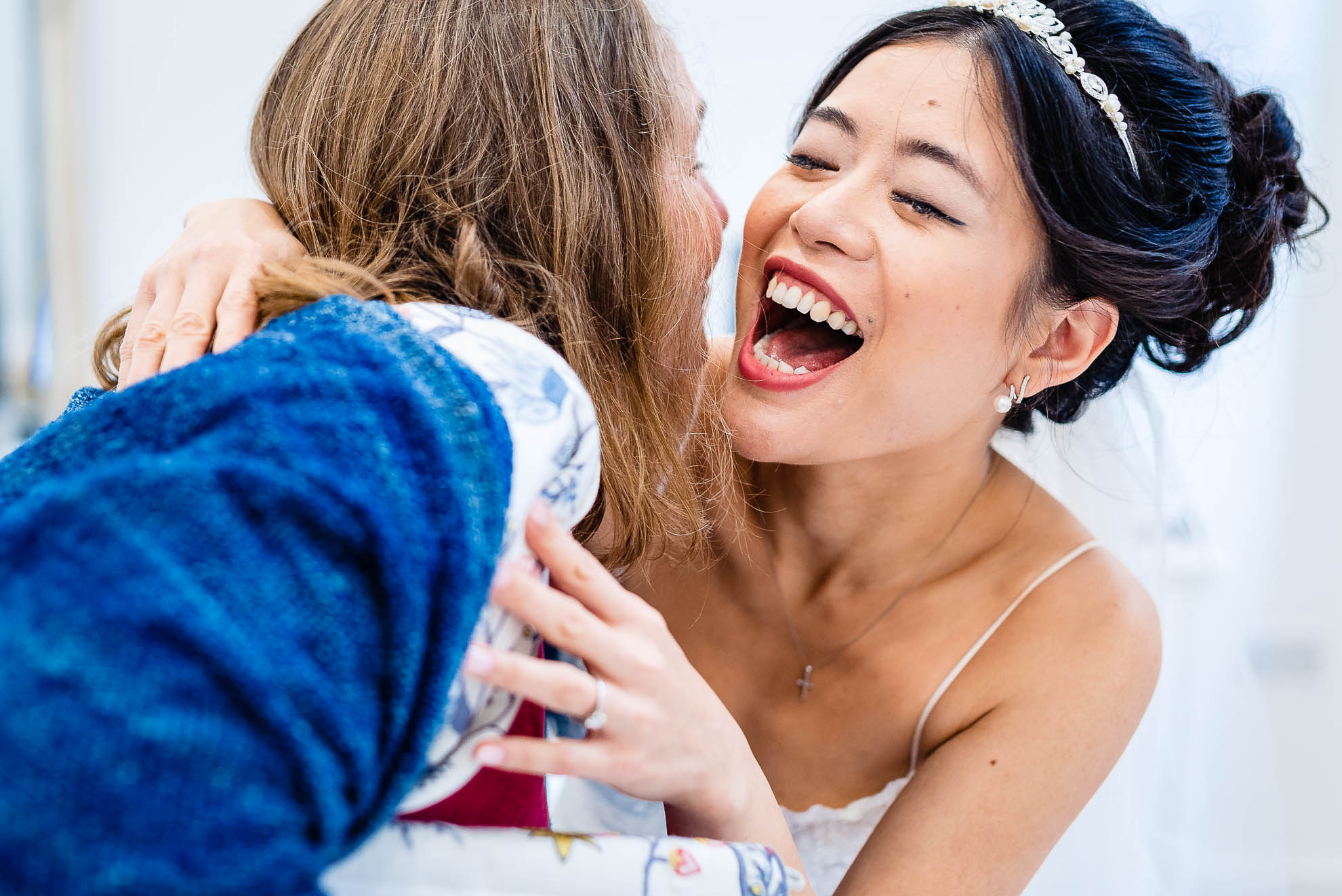 Bride hugs a wedding guest
