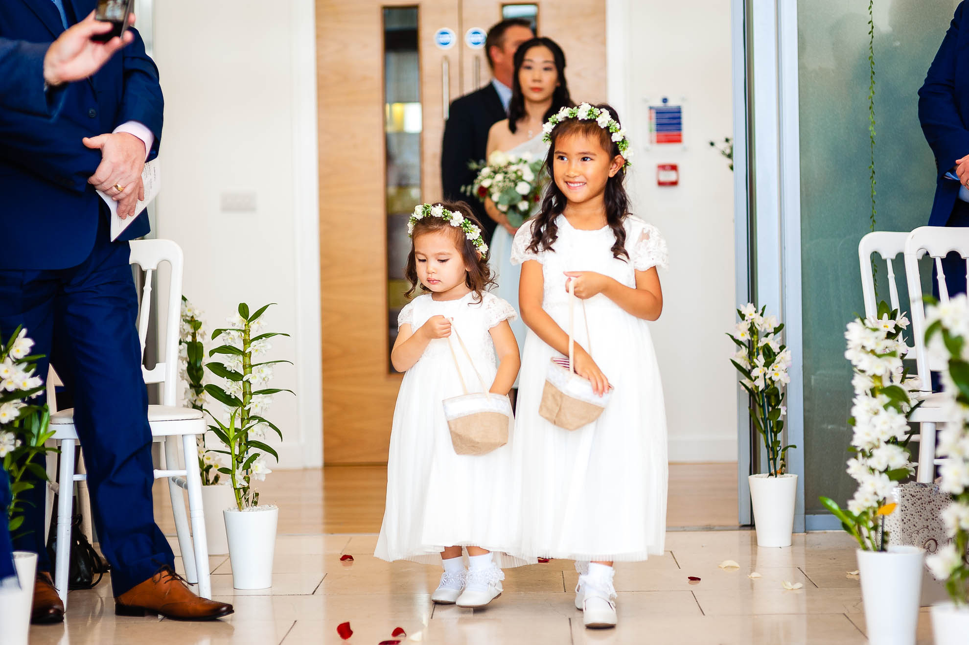 Flower girls walk up the aisle