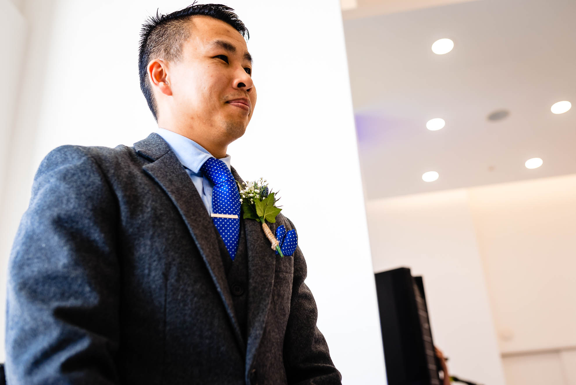 Groom looks at his bride as she walks up the aisle