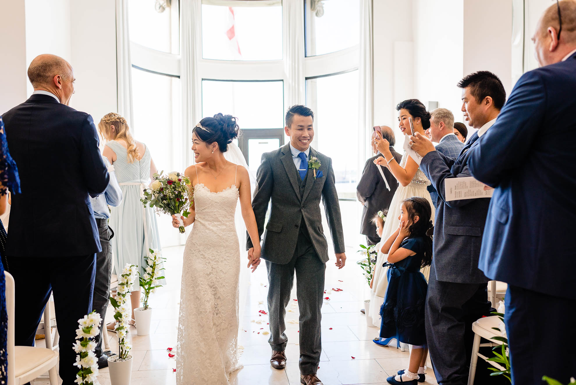 Bride and groom walk back down the aisle
