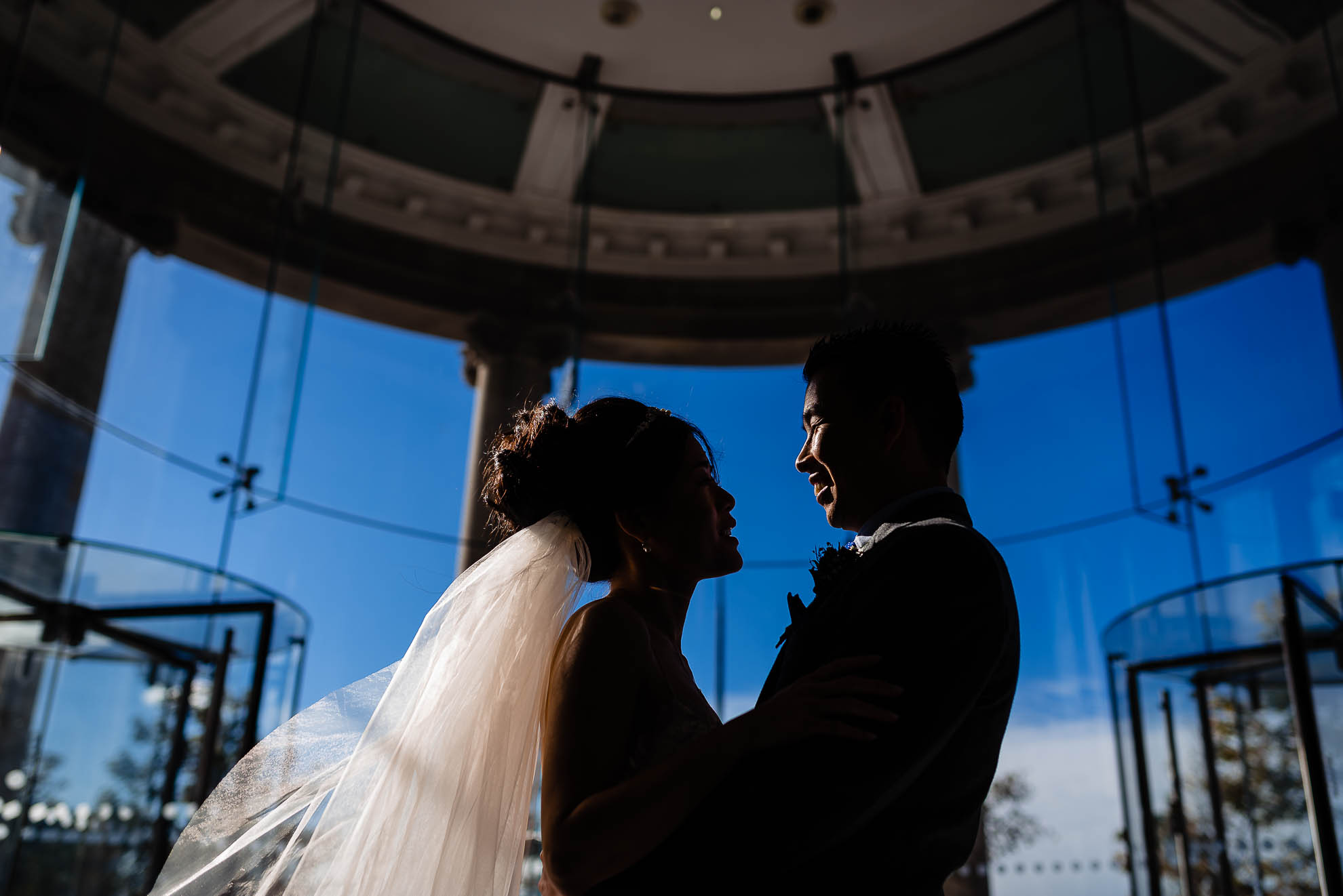 Bride and groom close up portrait in silhouette