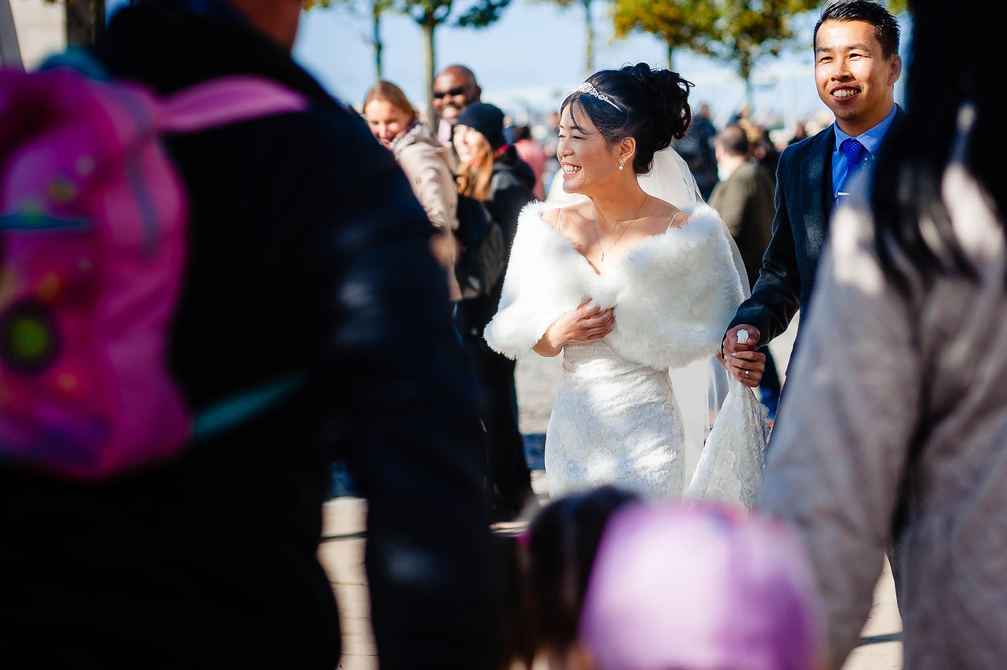 Bride and walking through crowds