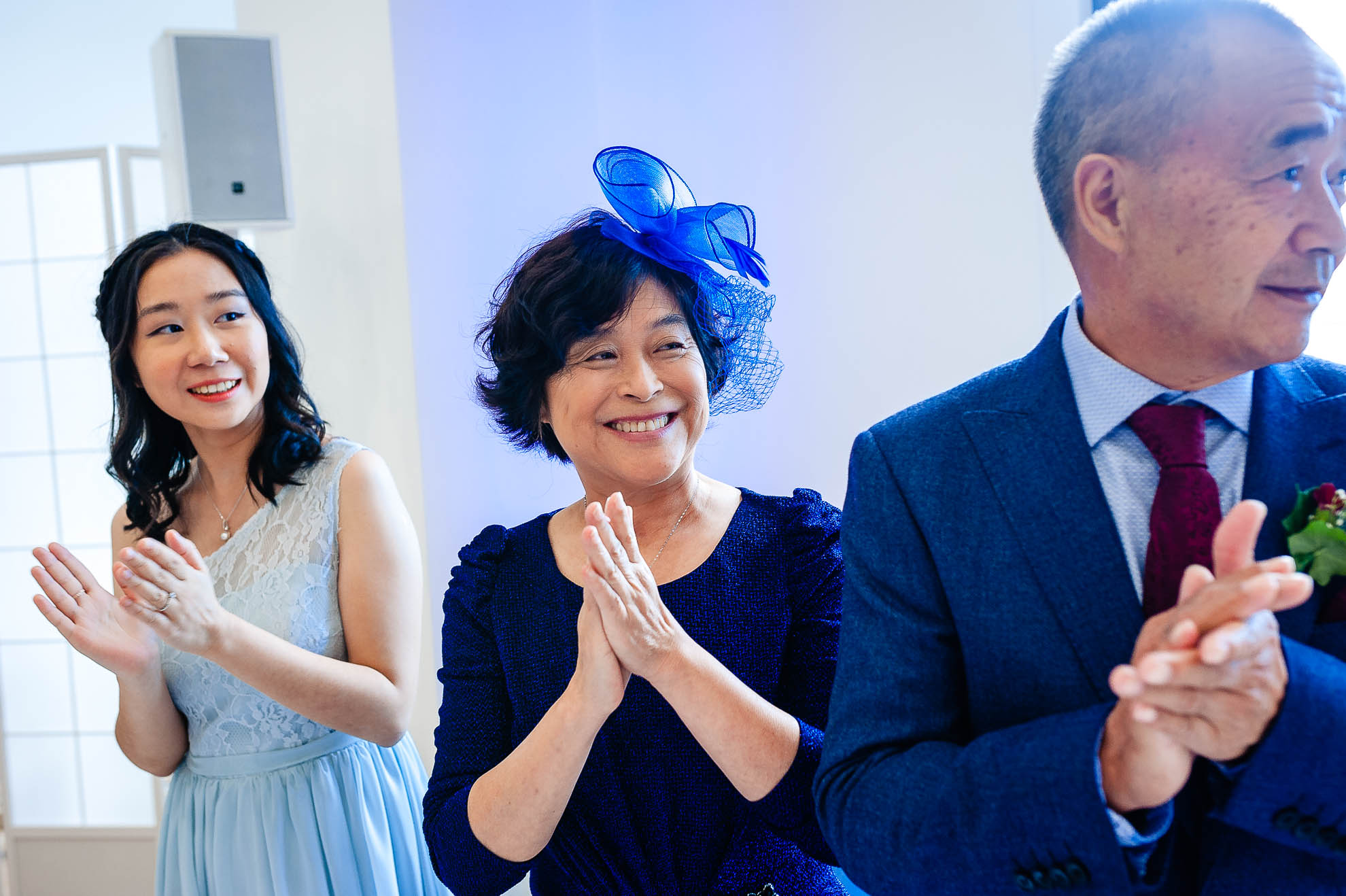 Brides mother and father applaud the happy couple