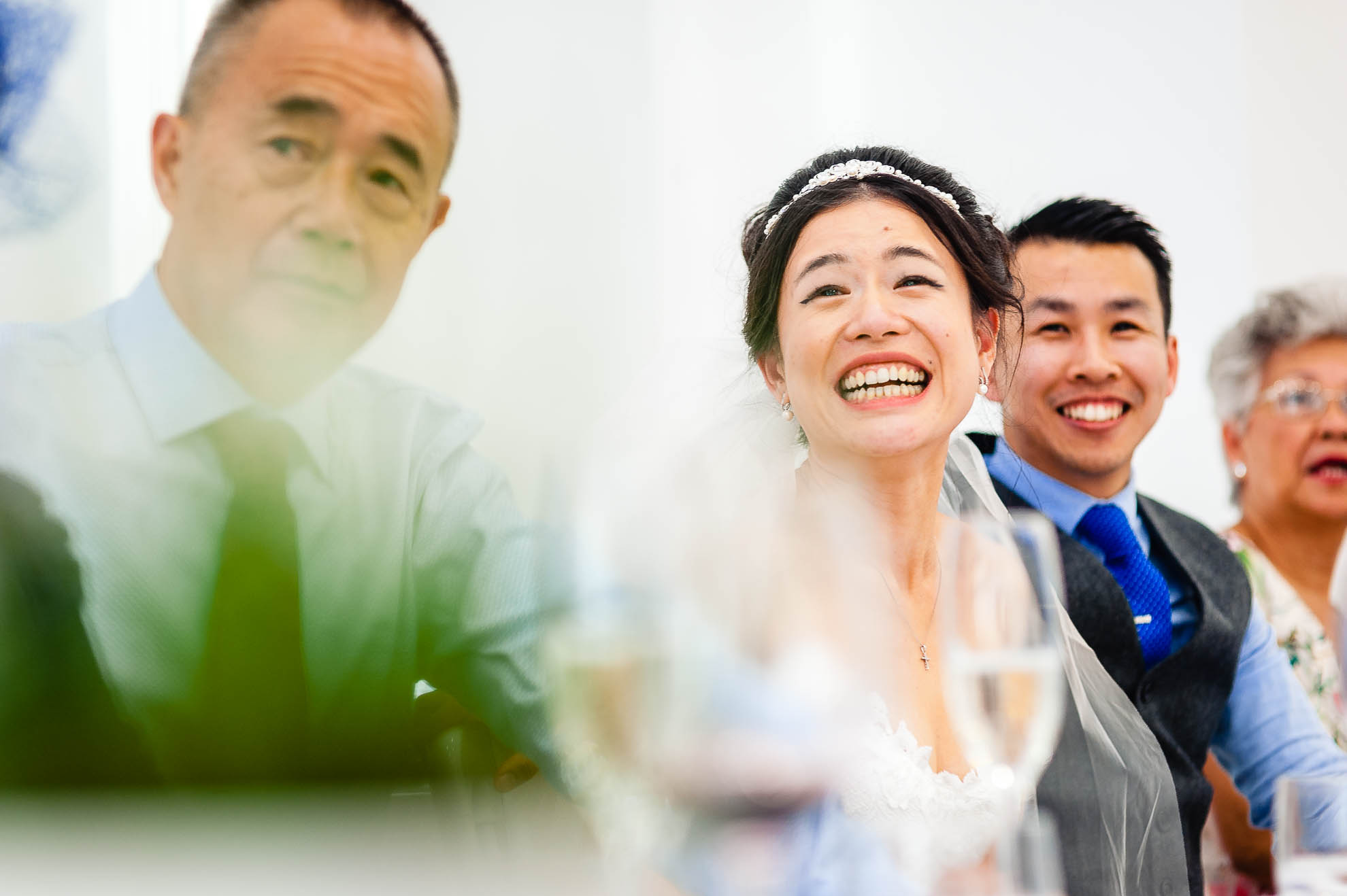 Bride smiles during speeches