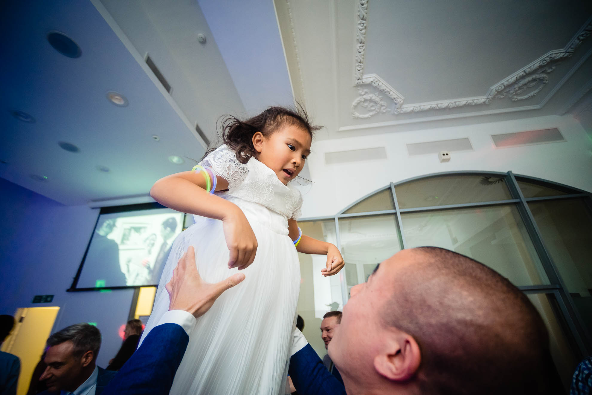 Little girl thrown up in the air
