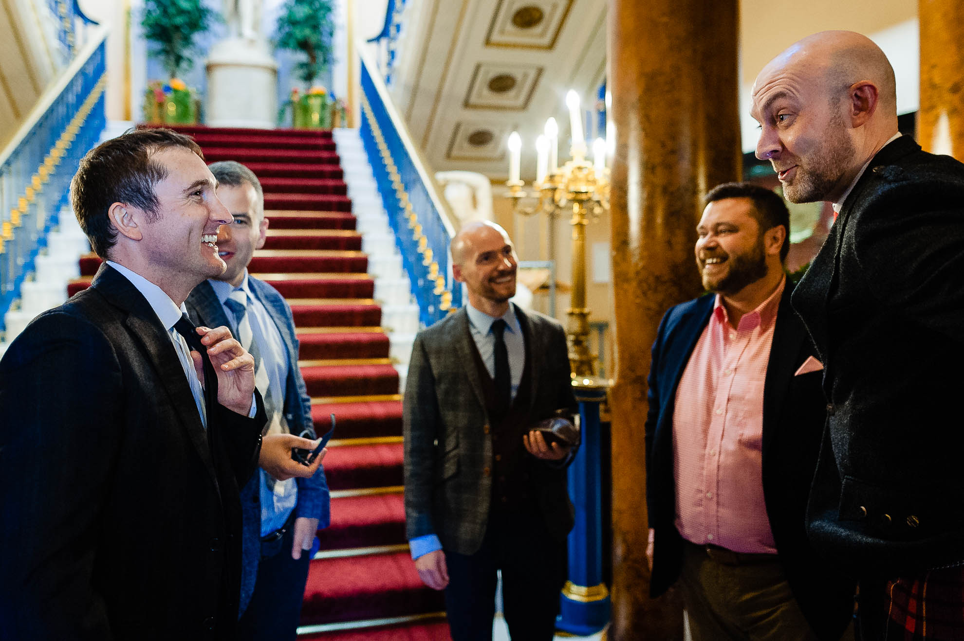 Wedding guests share a joke