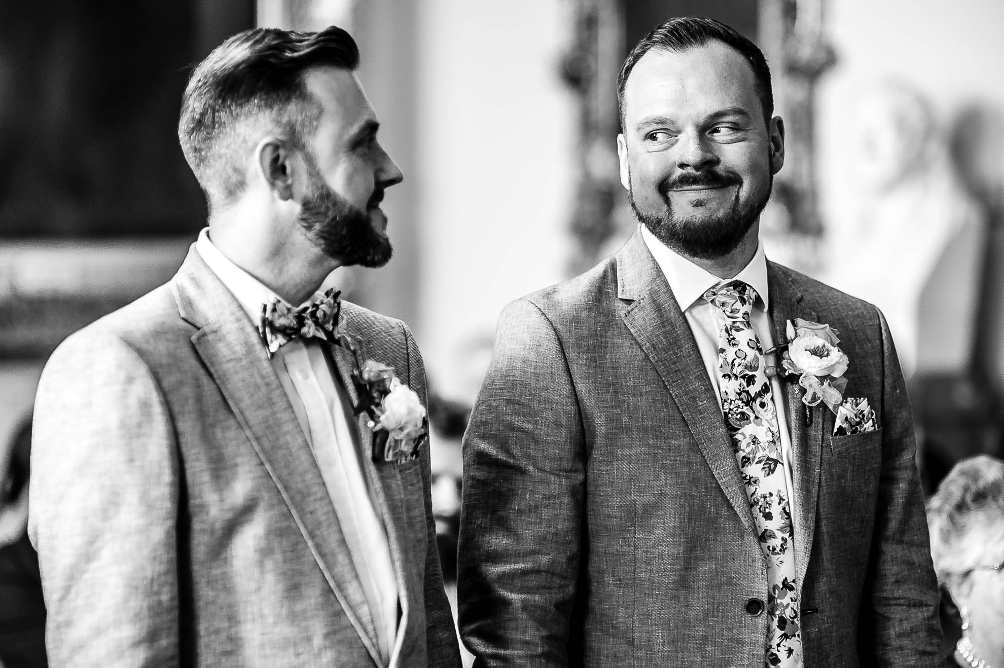 The couple smile at each other during the wedding ceremony