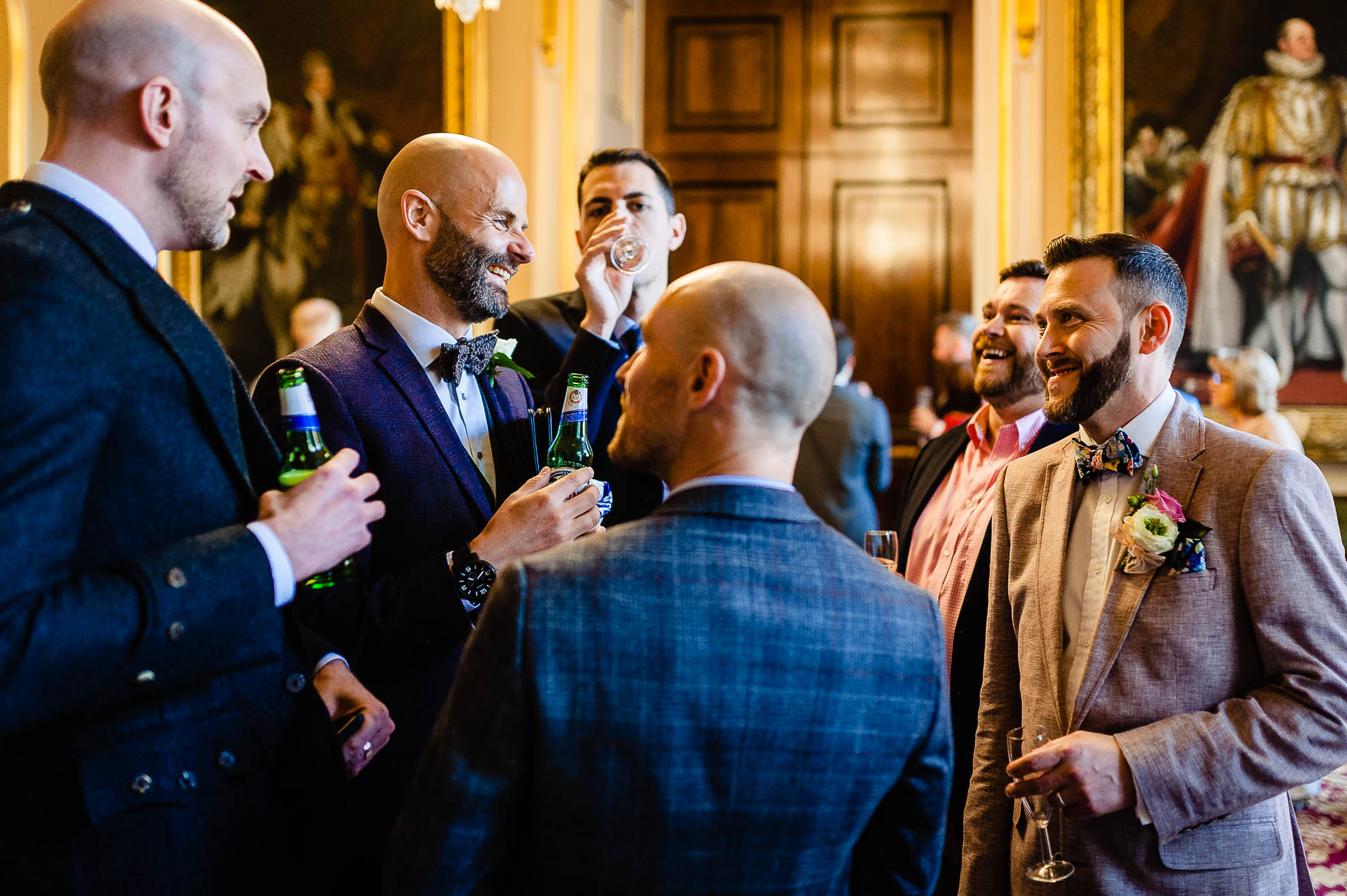 Groom share a joke with guests