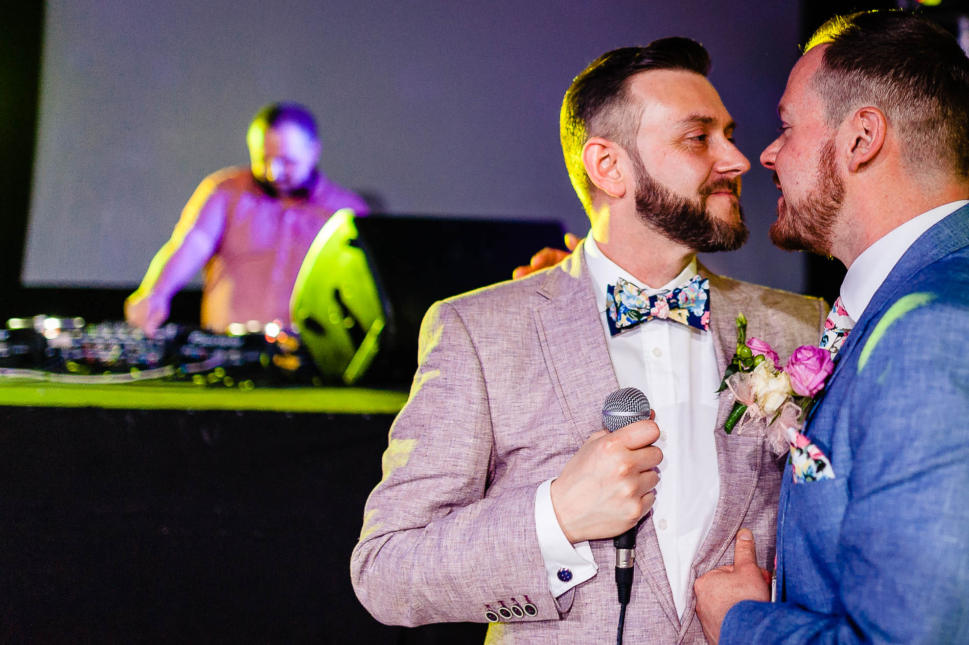 newlyweds stare into each others eyes during speeches