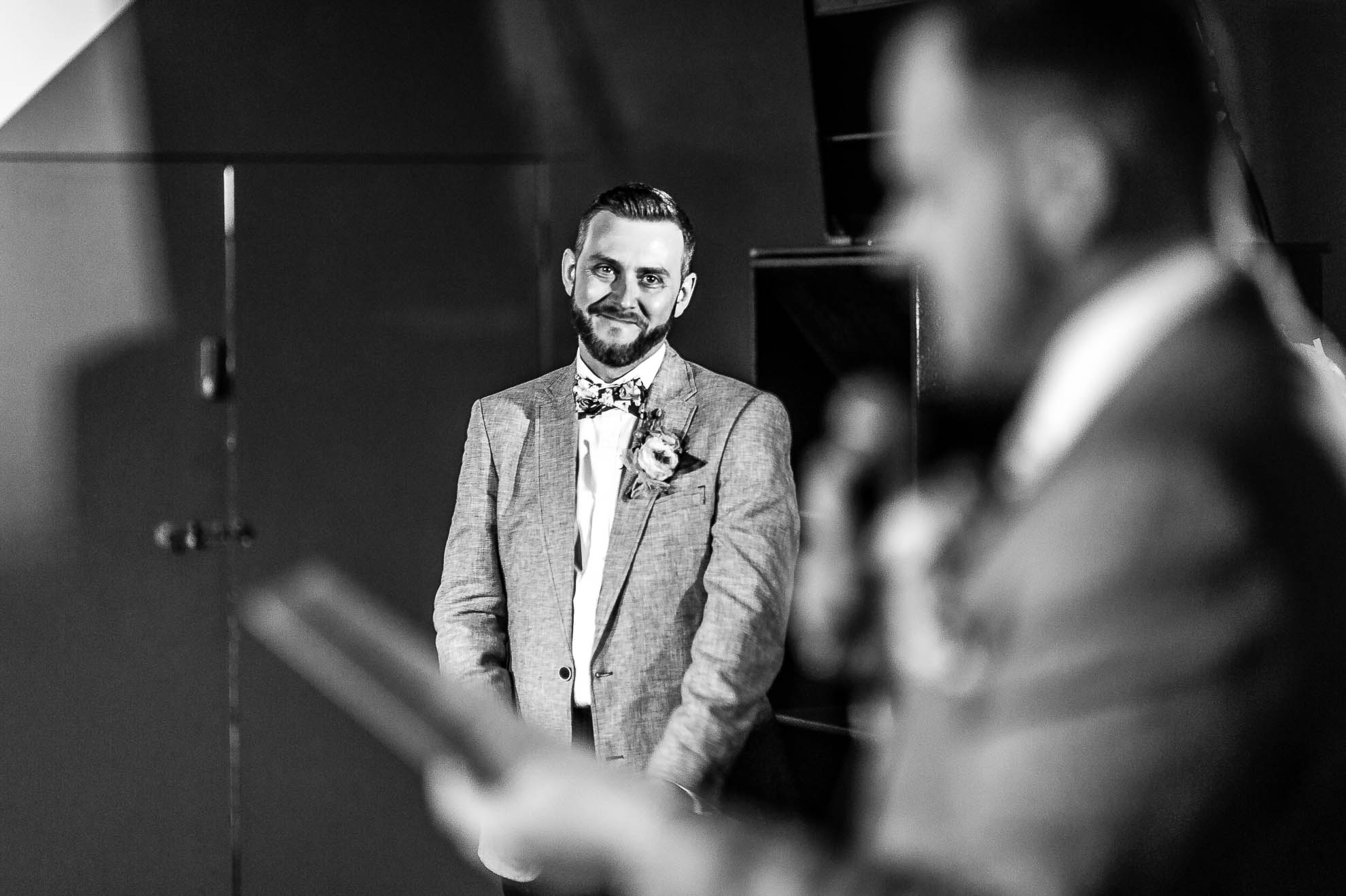 Groom looks over at his partner during the speeches