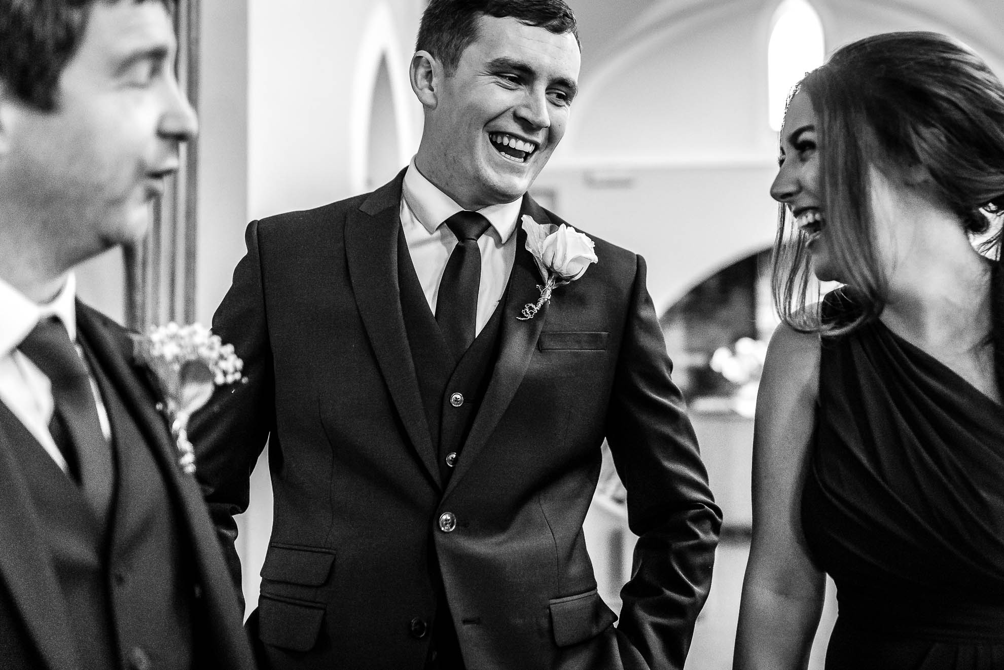 Usher and bridesmaid share a joke