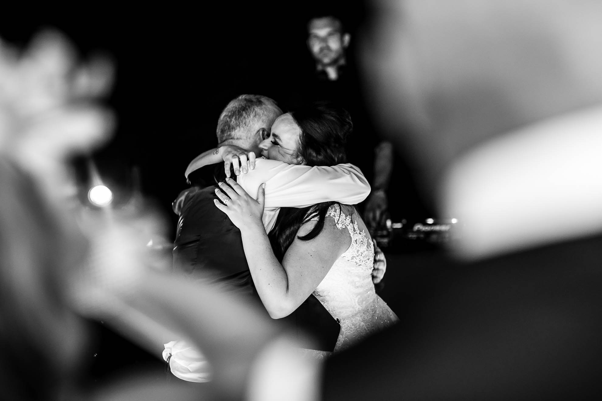 Bride and father of the bride big hug