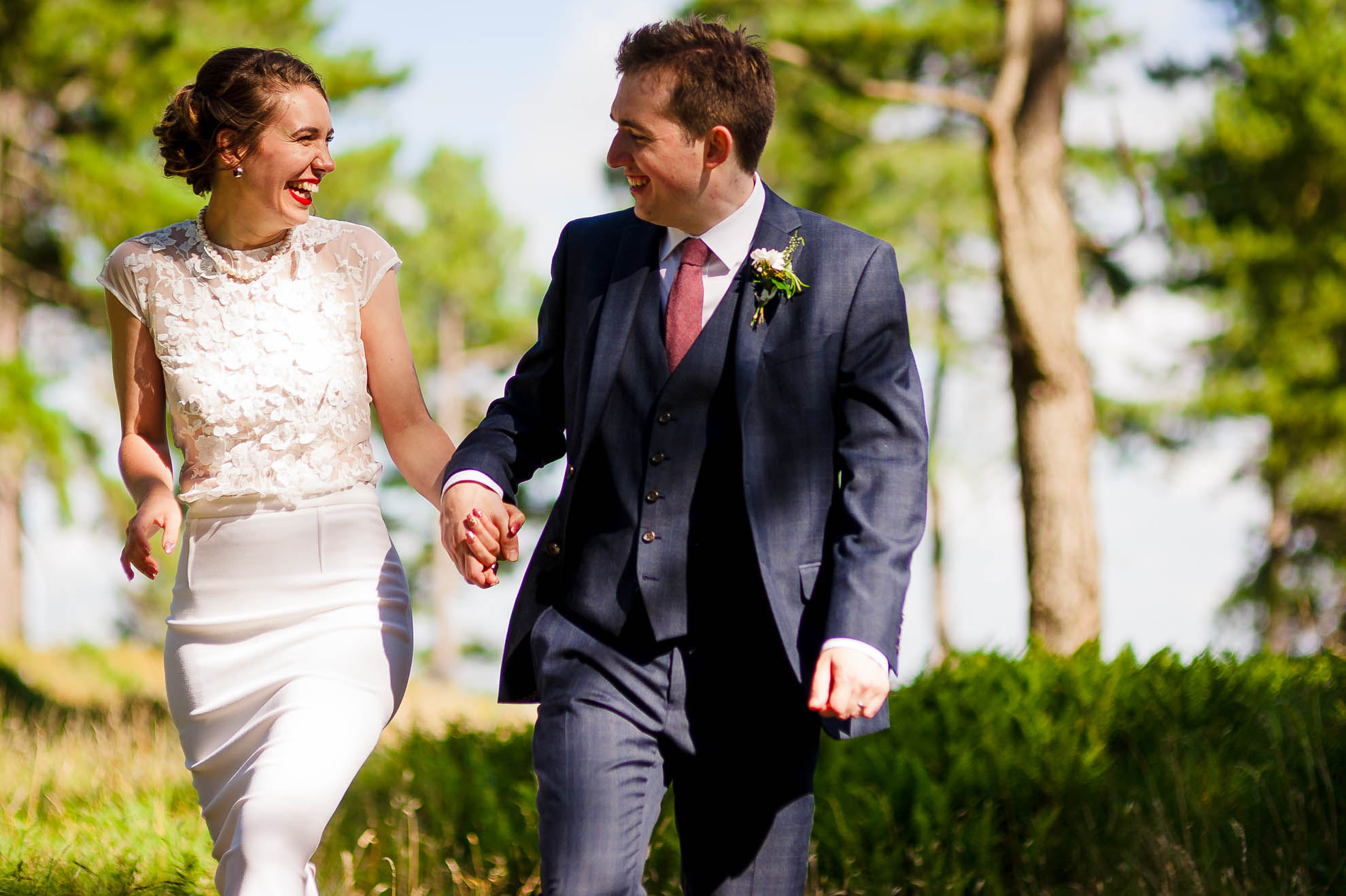 Bride and groom laugh together