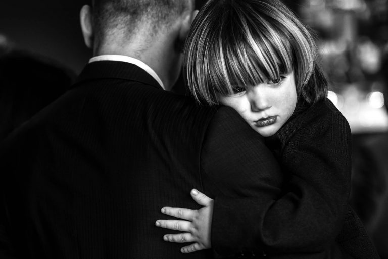 Little boy holding his dad