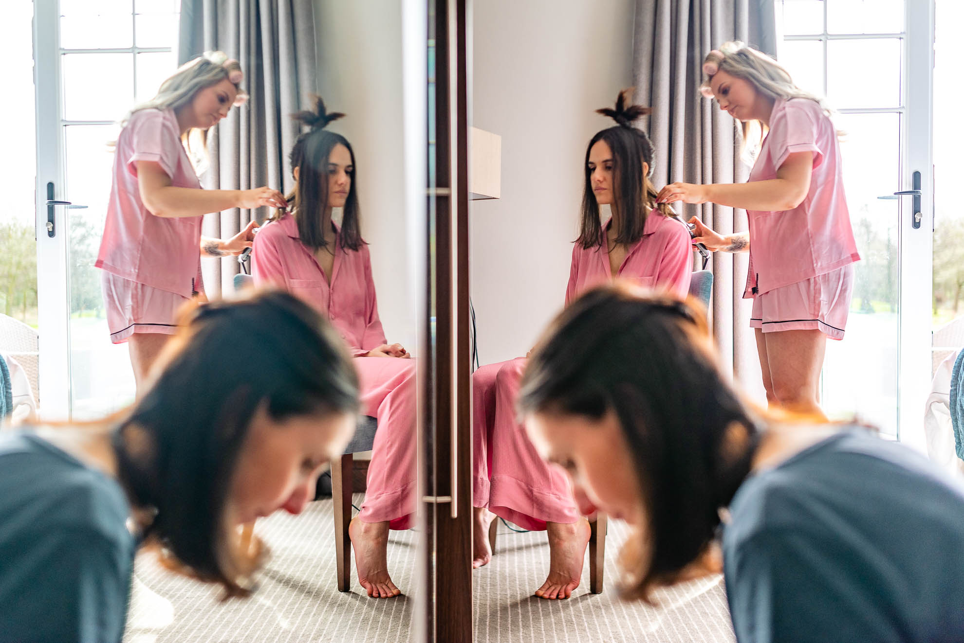 Bride reflection in mirror as she gets ready