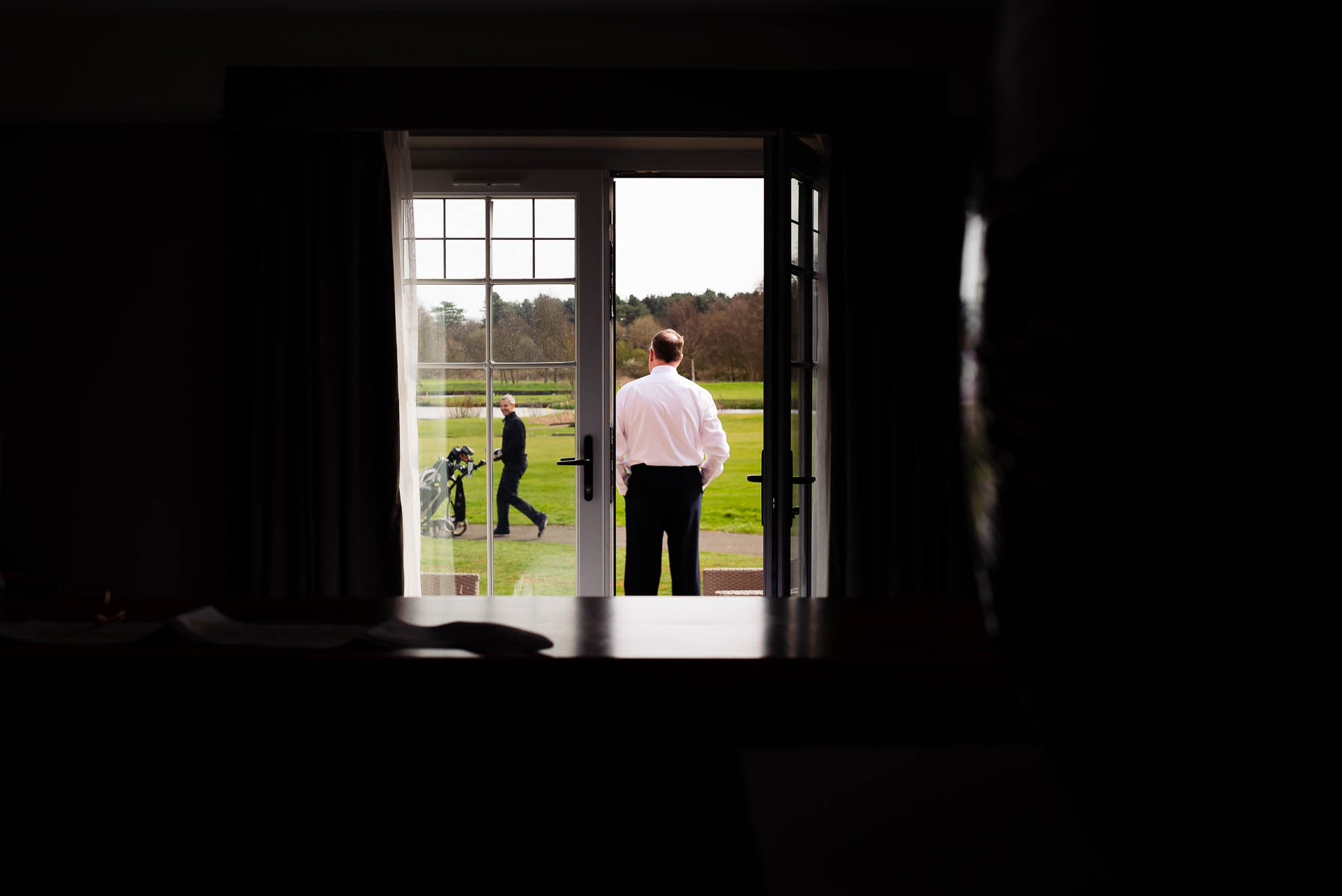Father of the bride looking out of the window