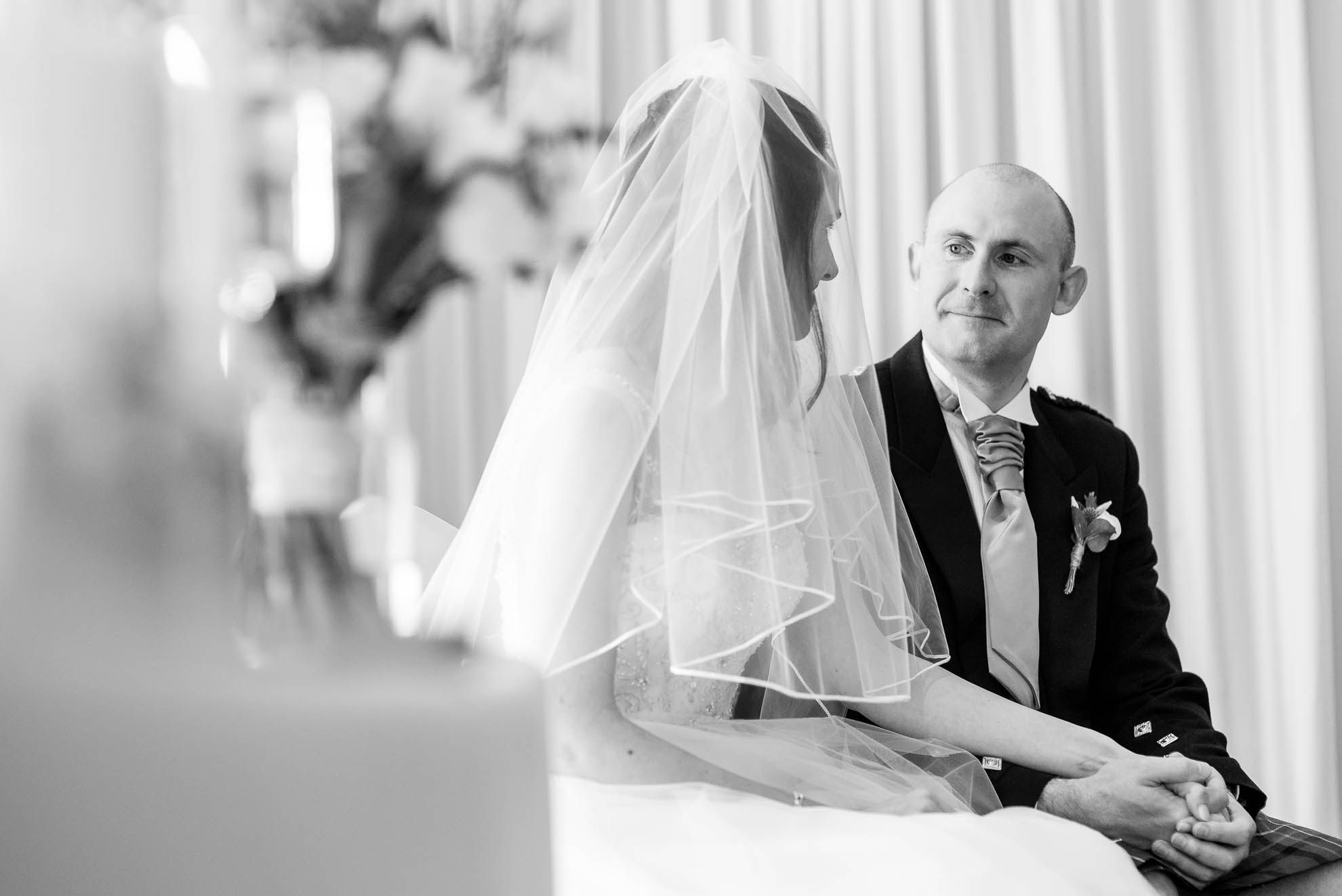 Bride and groom share a moment during the ceremony